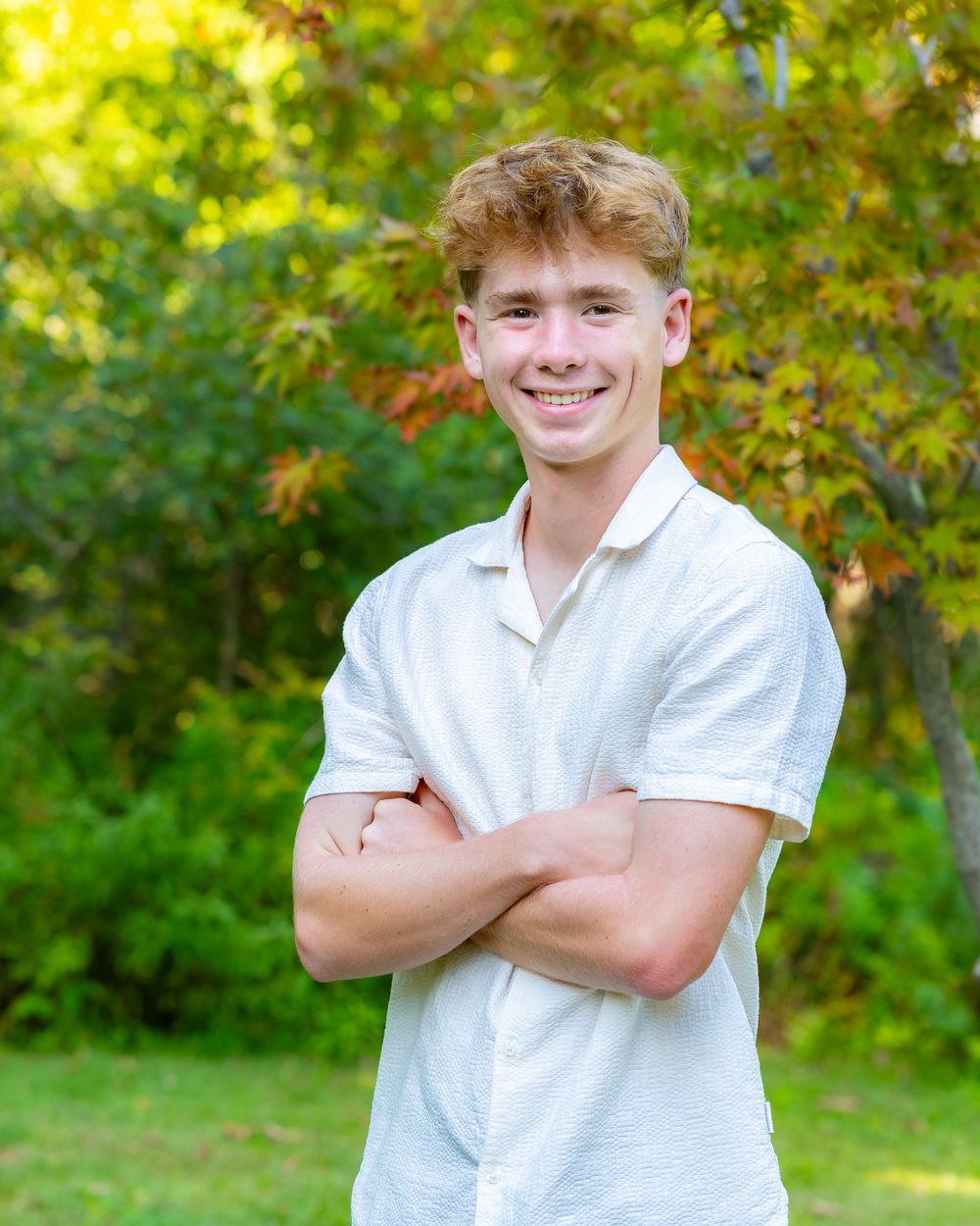 High School Senior poses for his yearbook portrait at home in Maynard, MA in the Metrowest of Boston with Lisa West Photography.