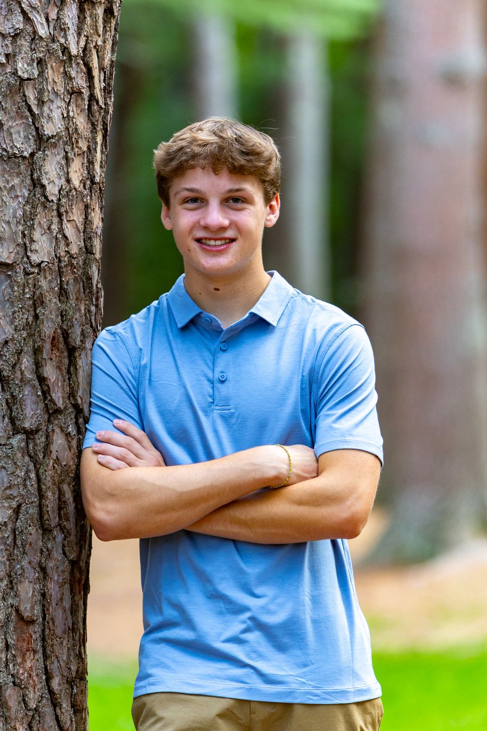 A high school senior poses for his yearbook portrait at Camp Sewataro in Sudbury, MA with Lisa West Photography www.lisawestphotography.com