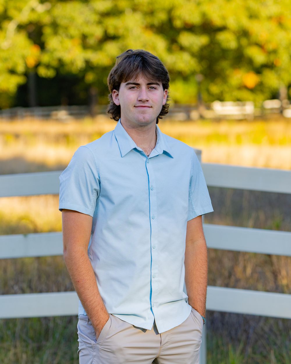 High School Senior poses for his yearbook photo at home in Sudbury, MA in the Metrowest of Boston with Lisa West Photography