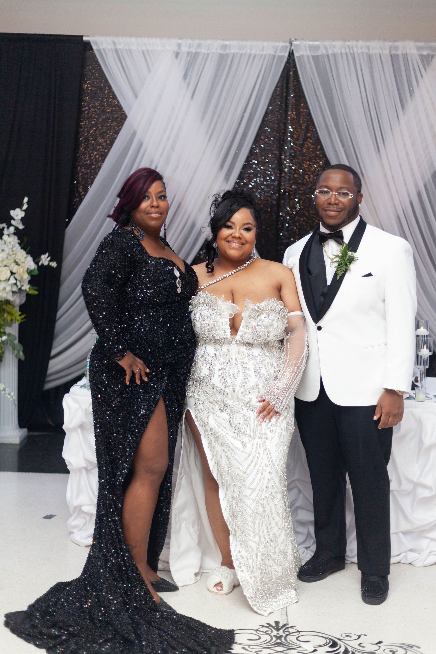 Four elegant photos showing wedding party members in black and white formal attire posing against a white draped backdrop.