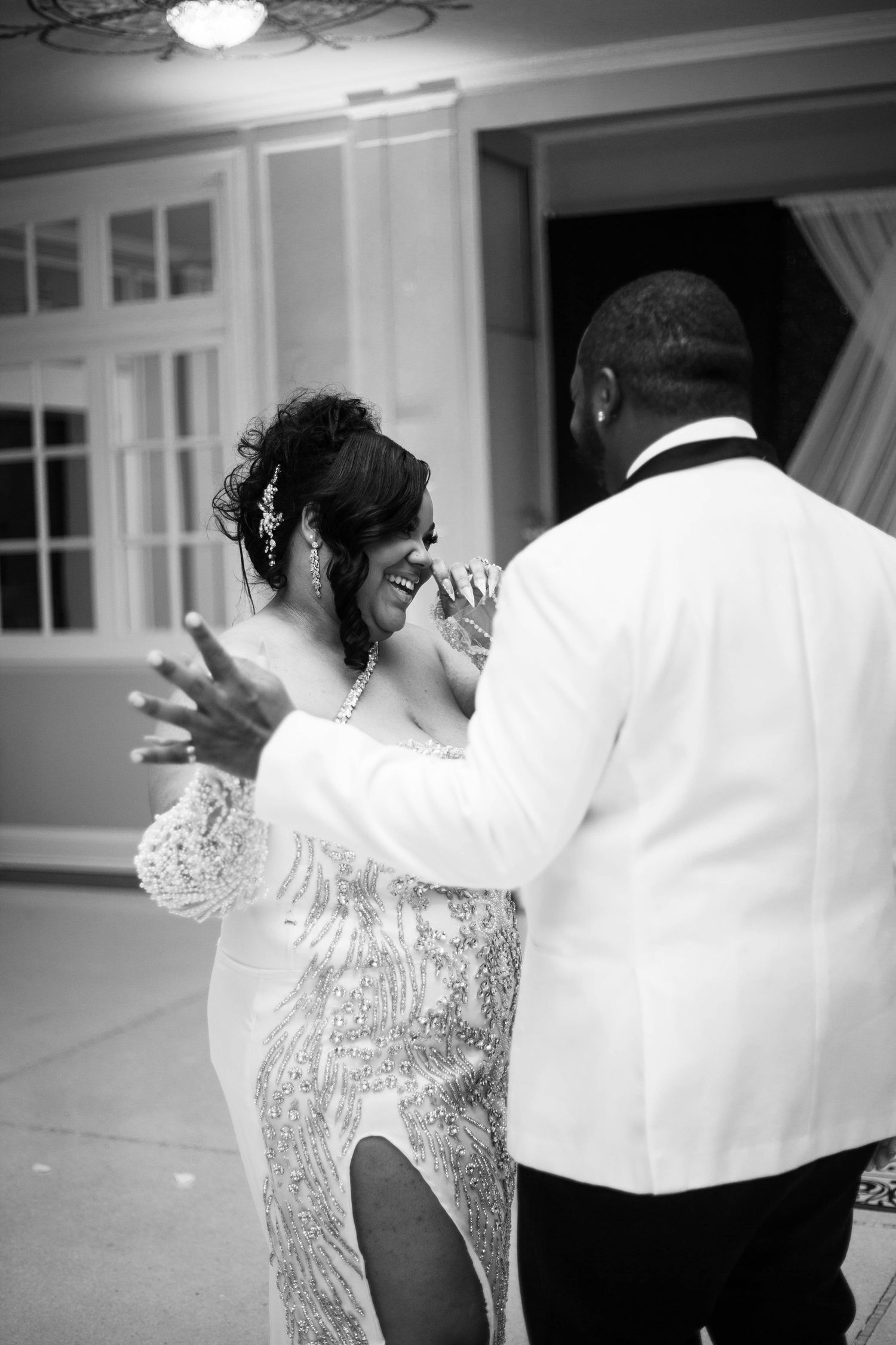 A sequence of black and white photos showing a couple dancing together at their wedding celebration.