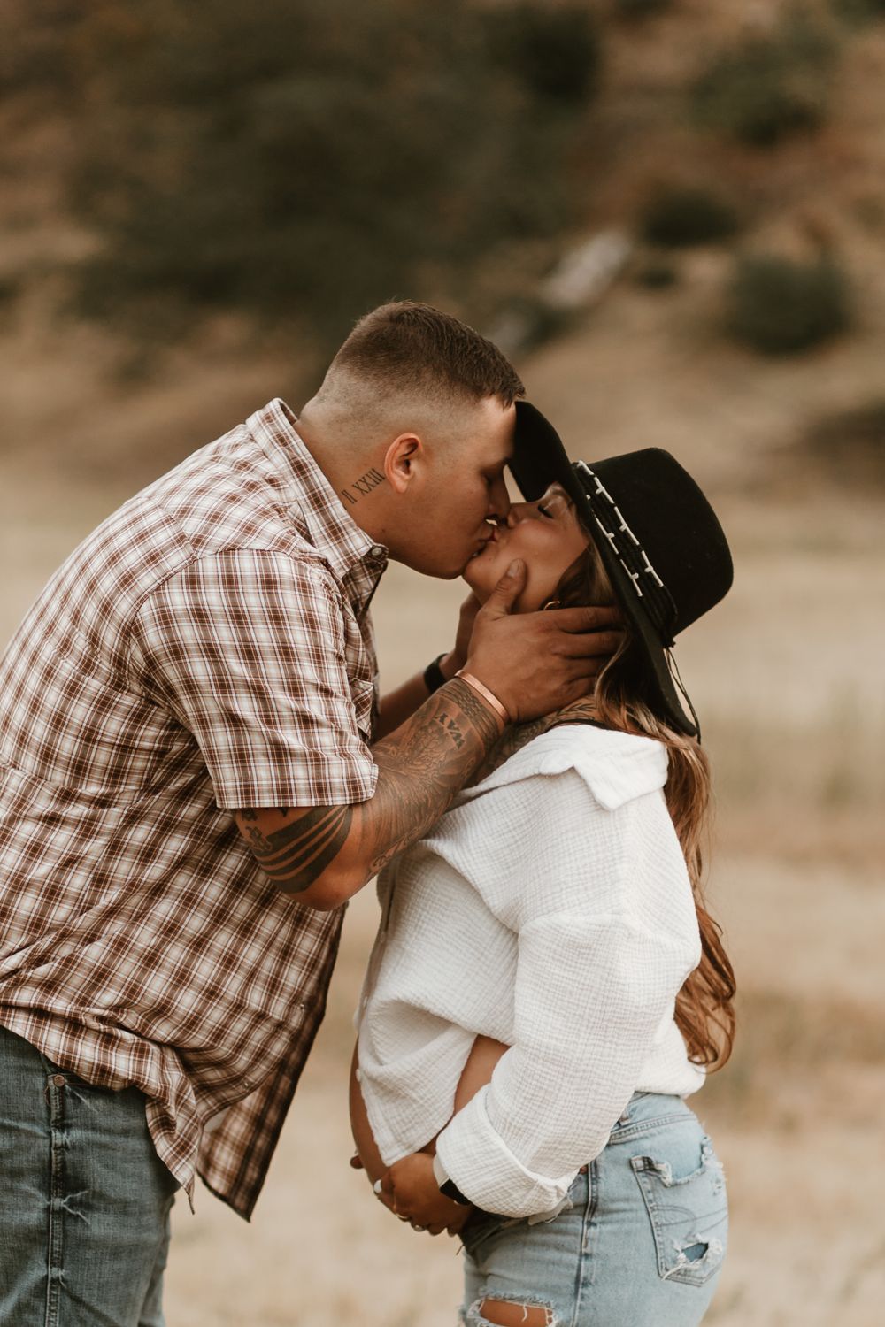 A series of romantic photos showing a couple embracing and kissing in a casual outdoor setting.