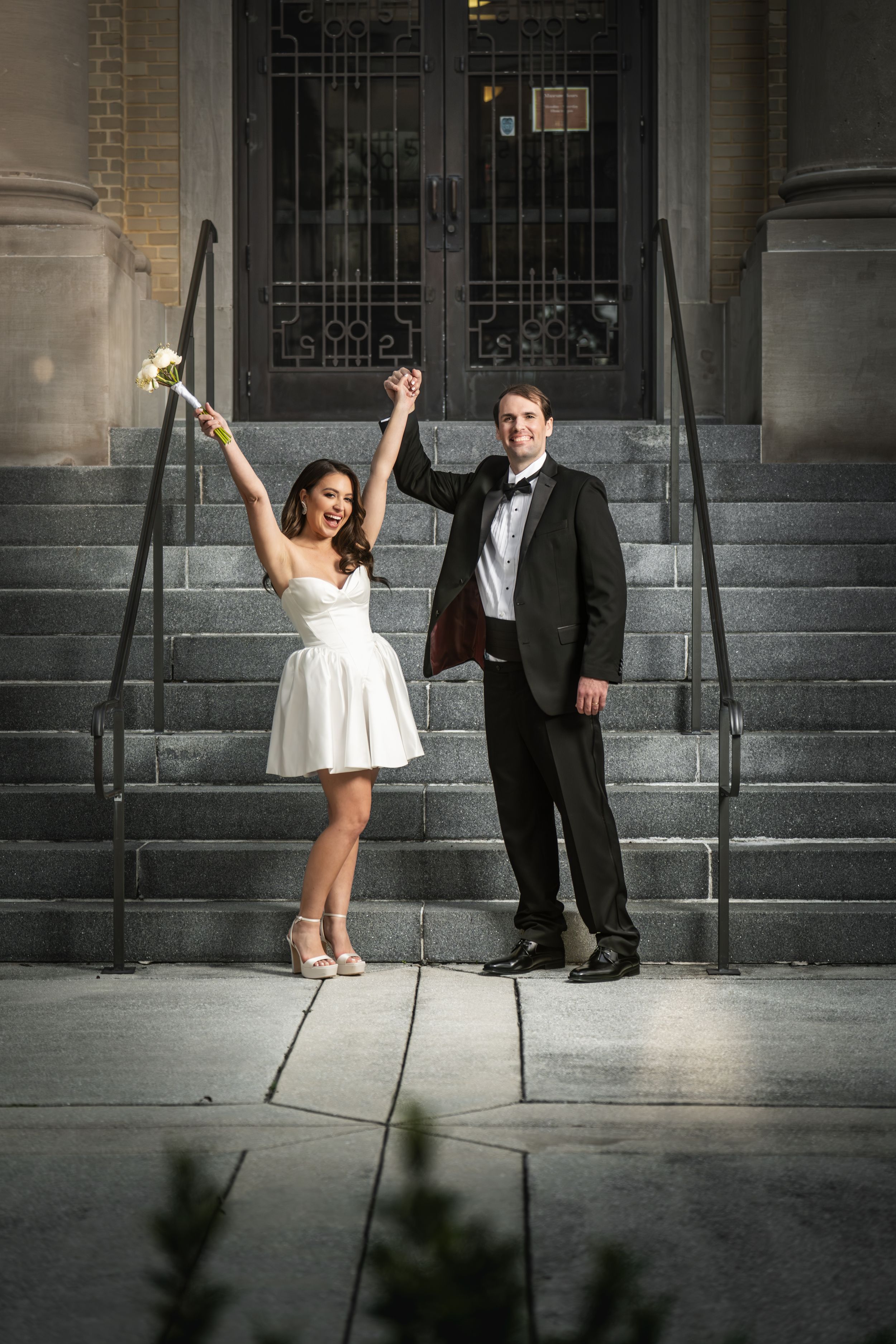 A sequence of four wedding photos showing a playful dance pose on stone steps with a formal suited figure and white dress.