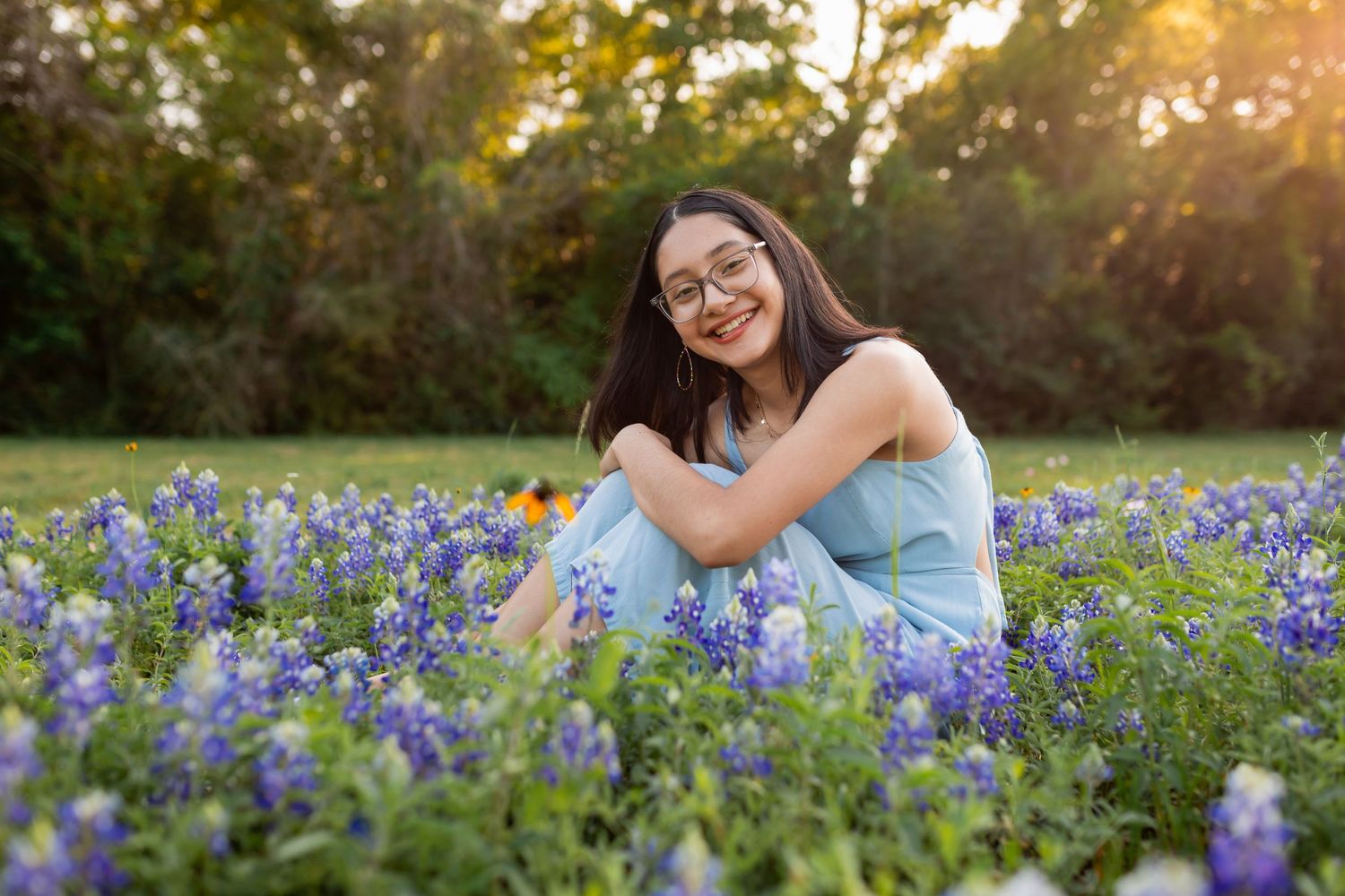 A series of outdoor portrait photos taken in a blooming bluebonnet field during golden hour sunset.