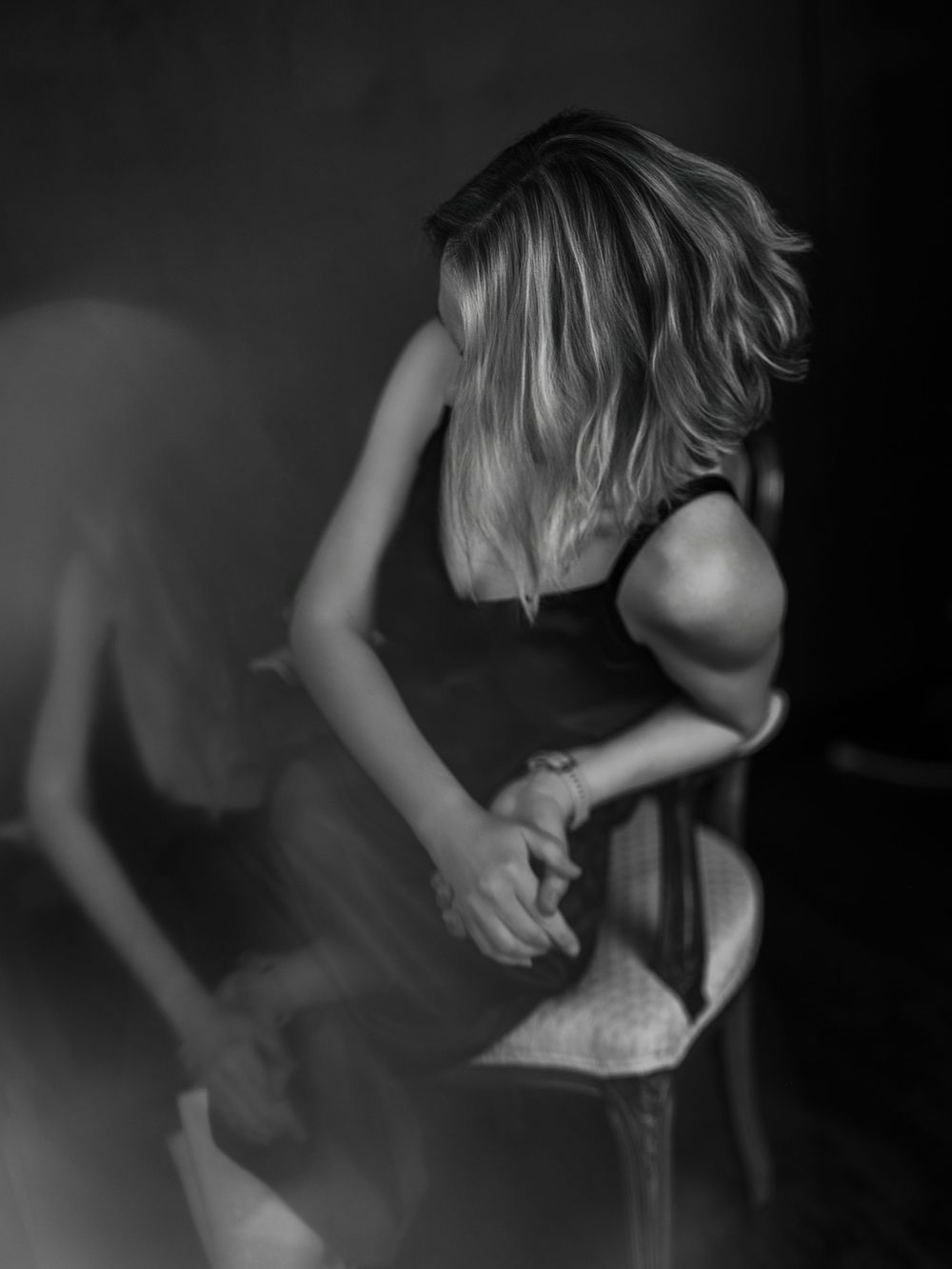 Black and white artistic sequence showing abstract motion and movement in low light.