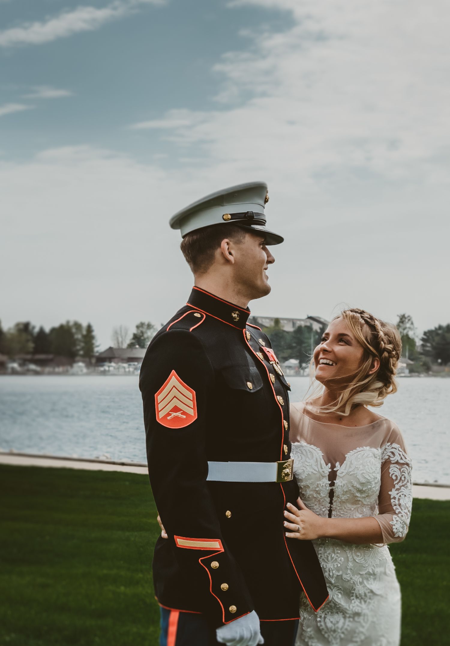 A bride and groom share joyful moments by the waterfront in a series of candid wedding photos.