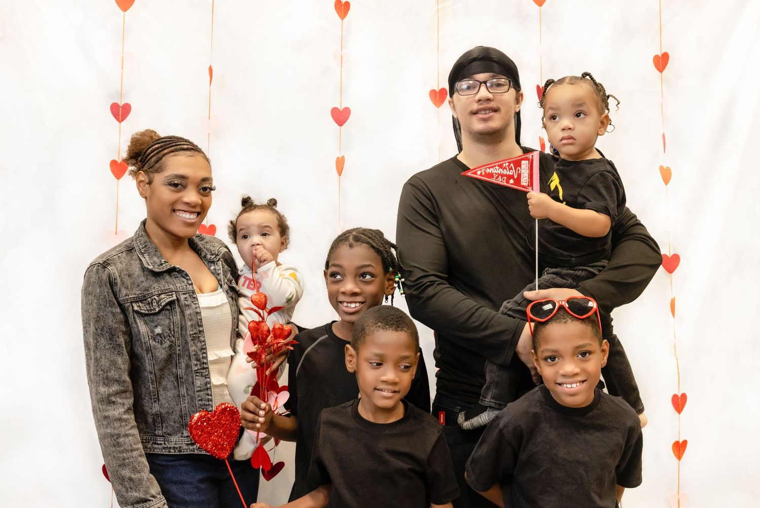 Family valentine session, five children, two parents dressed casually looking at camera