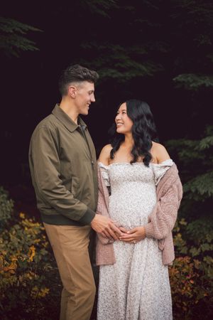 Couple standing together during their adventure and maternity photoshoot at Snoqualmie Pass near Seattle, Washington