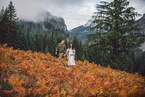 Couple walking together during their adventure and maternity photoshoot at Snoqualmie Pass near Seattle, Washington