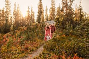 Family walking together during their family adventure photography session at Mt. Rainier National Park near Seattle, Washington