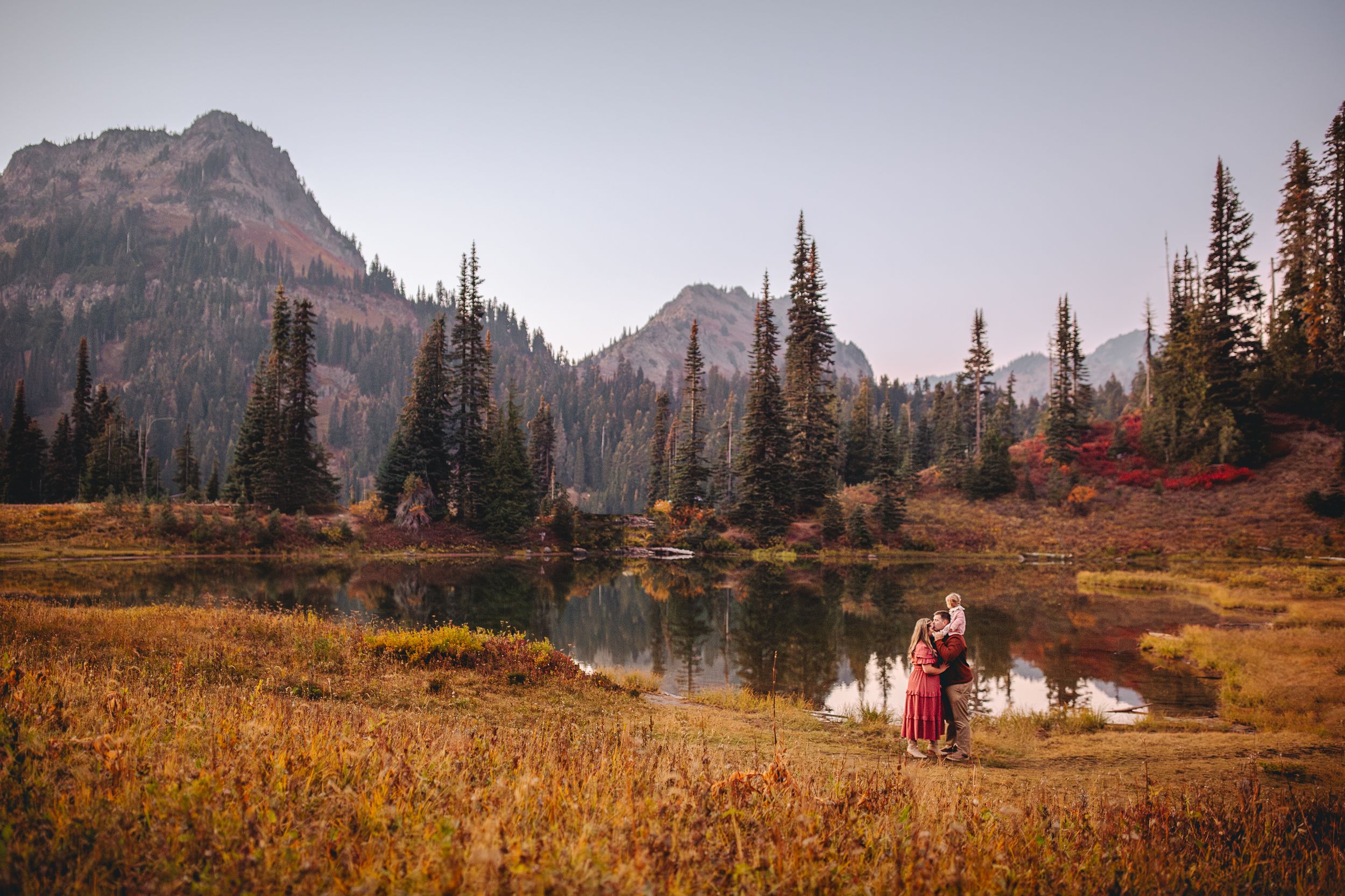 Family hugging together during their family adventure photography session at Mt. Rainier National Park near Seattle, Washington