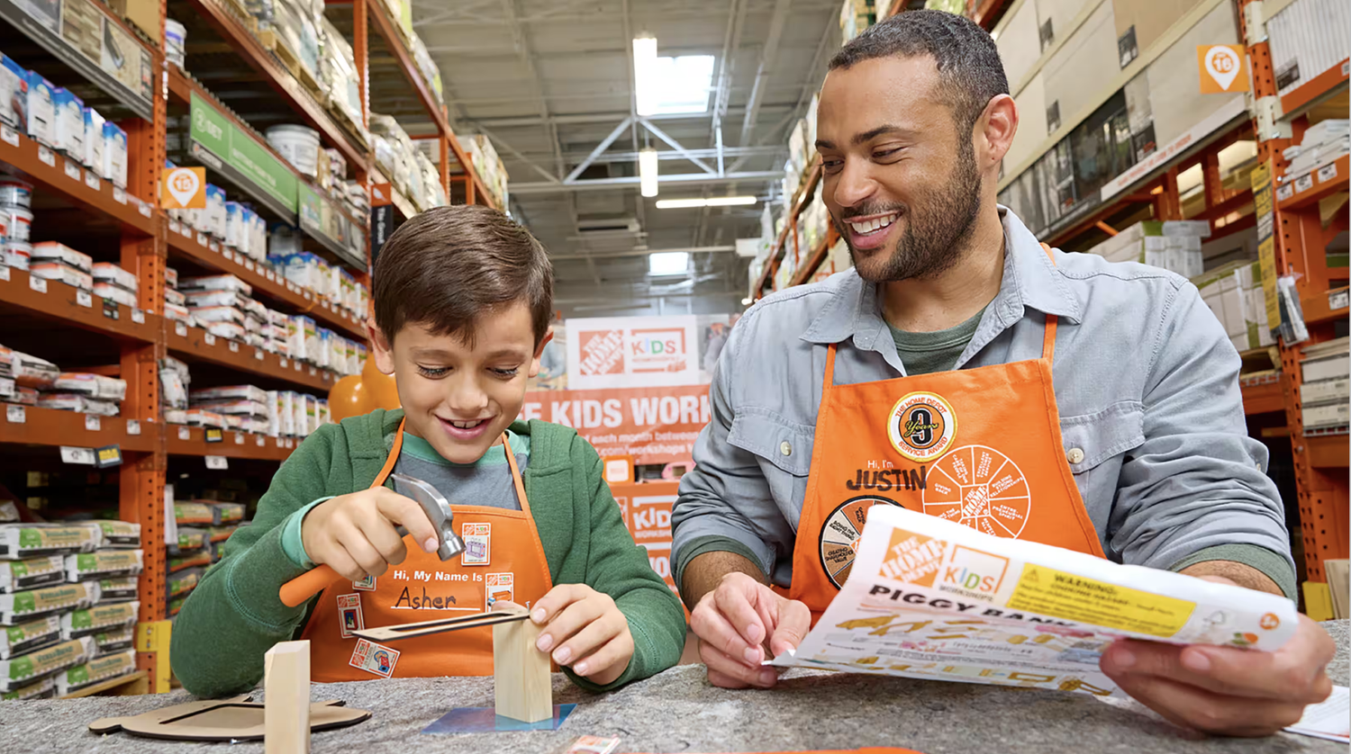 A man and child interacting during a Home Depot children's workshop in Littleton, CO