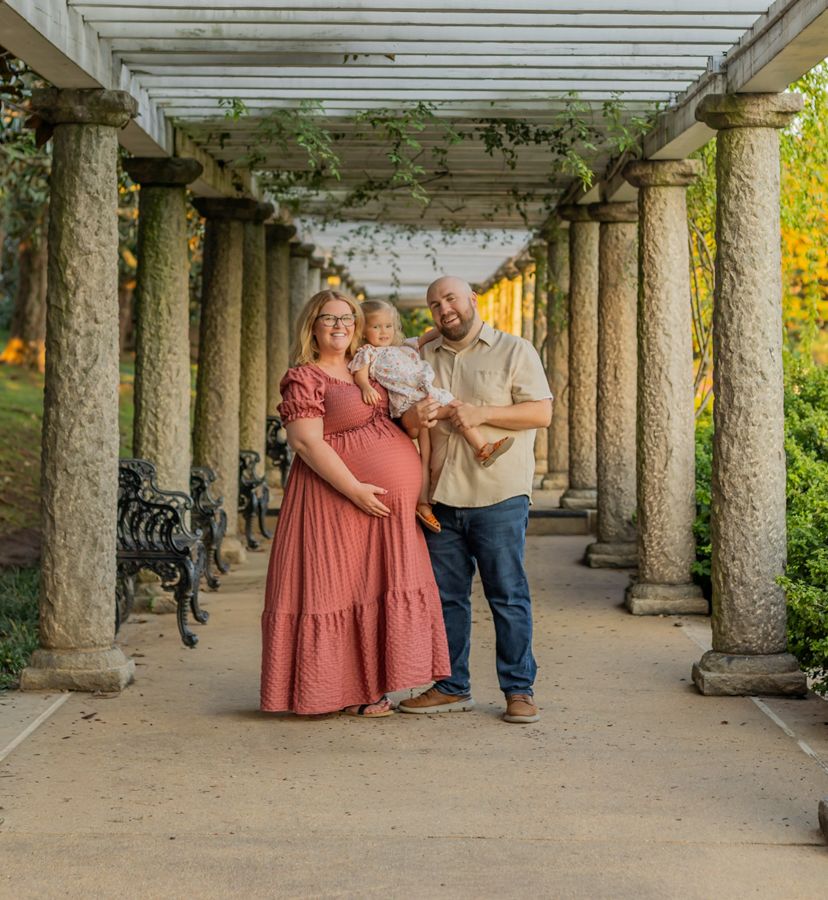 family maternity session in maymont Park in Richmond, Viriginia. Mom and dad holding first born and baby bump