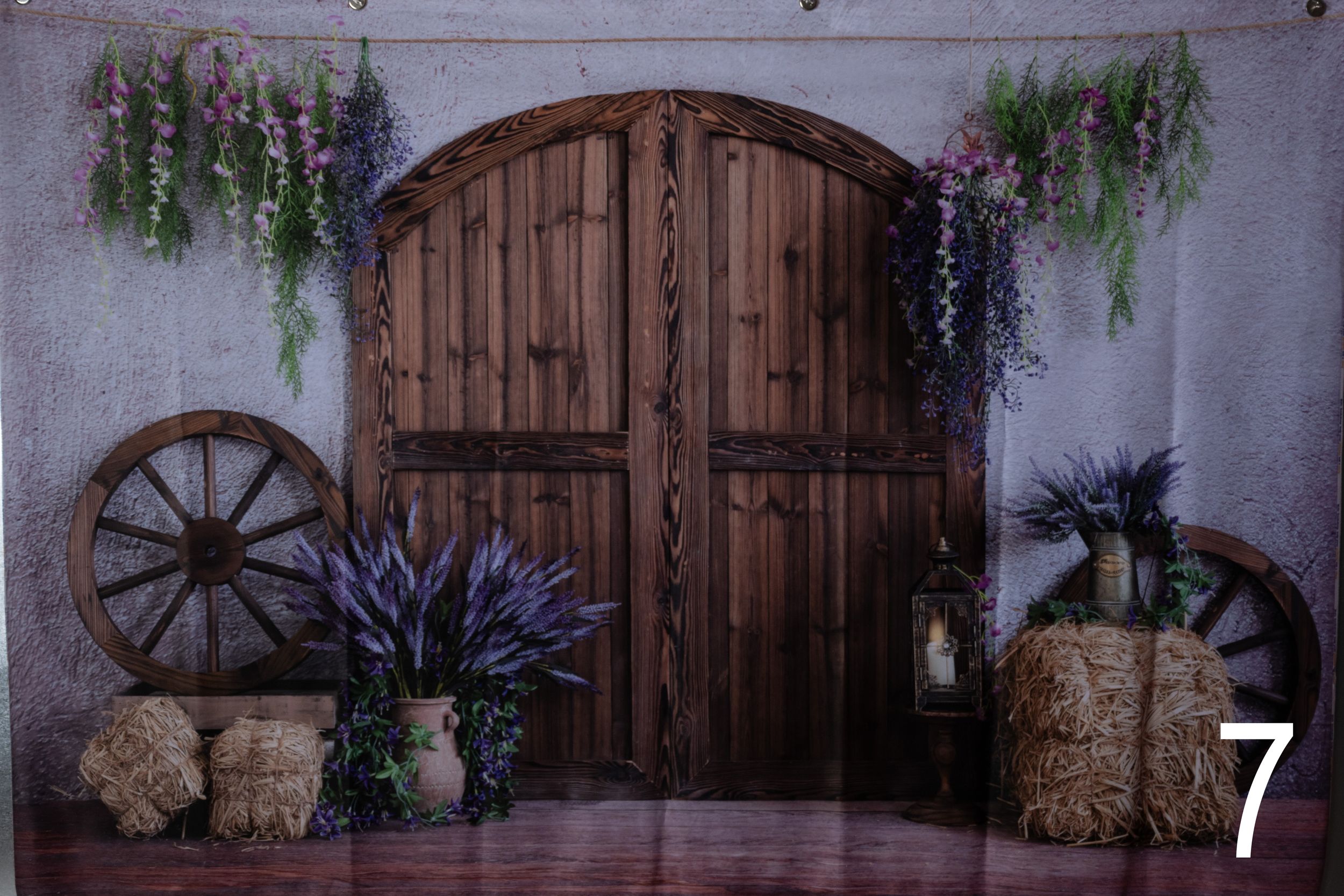 Rustic wooden barn doors and vintage decor create a romantic indoor wedding ceremony backdrop.