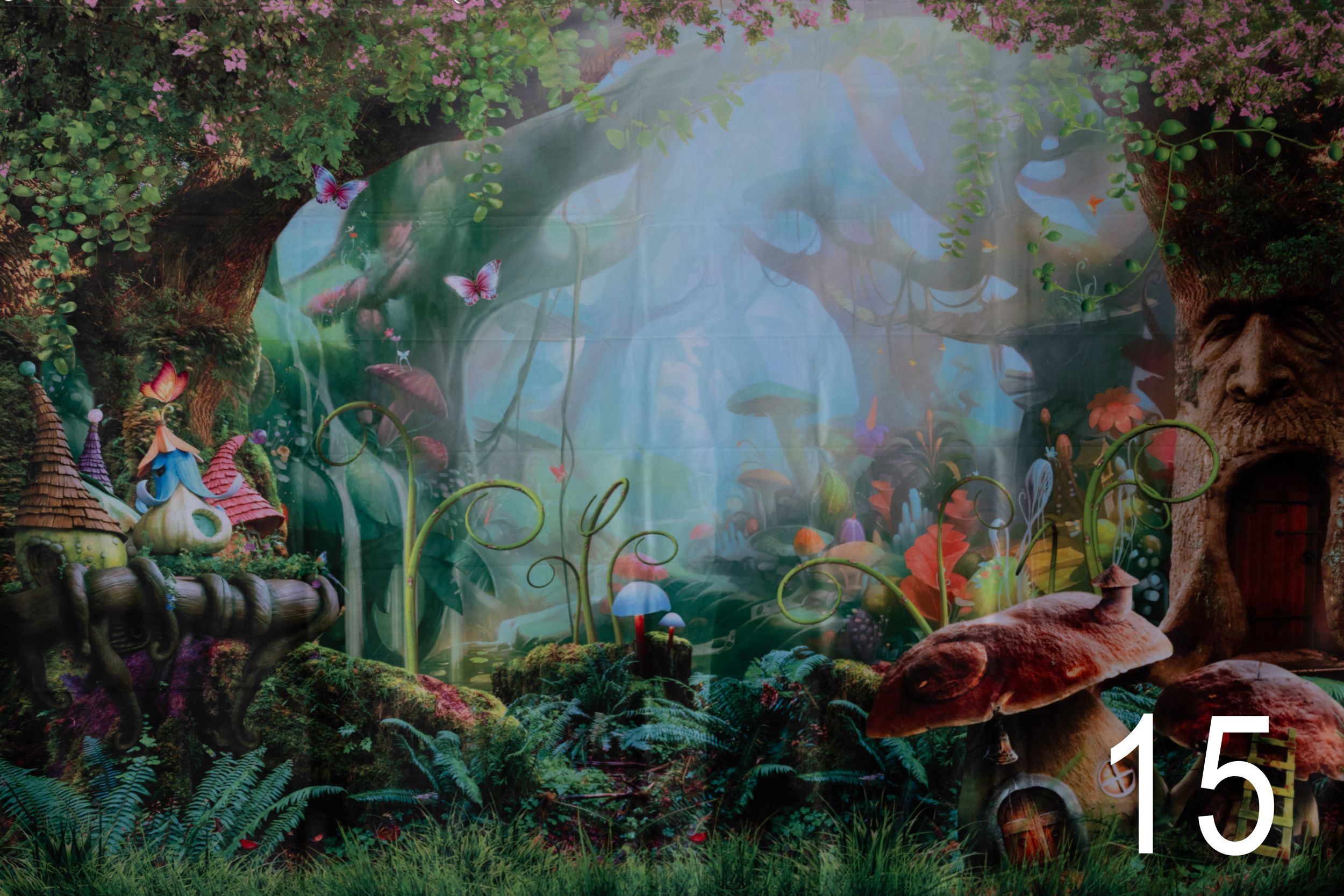 Enchanted forest scene with lush greenery, glowing lights, and mystical atmosphere in a fantasy video game environment.