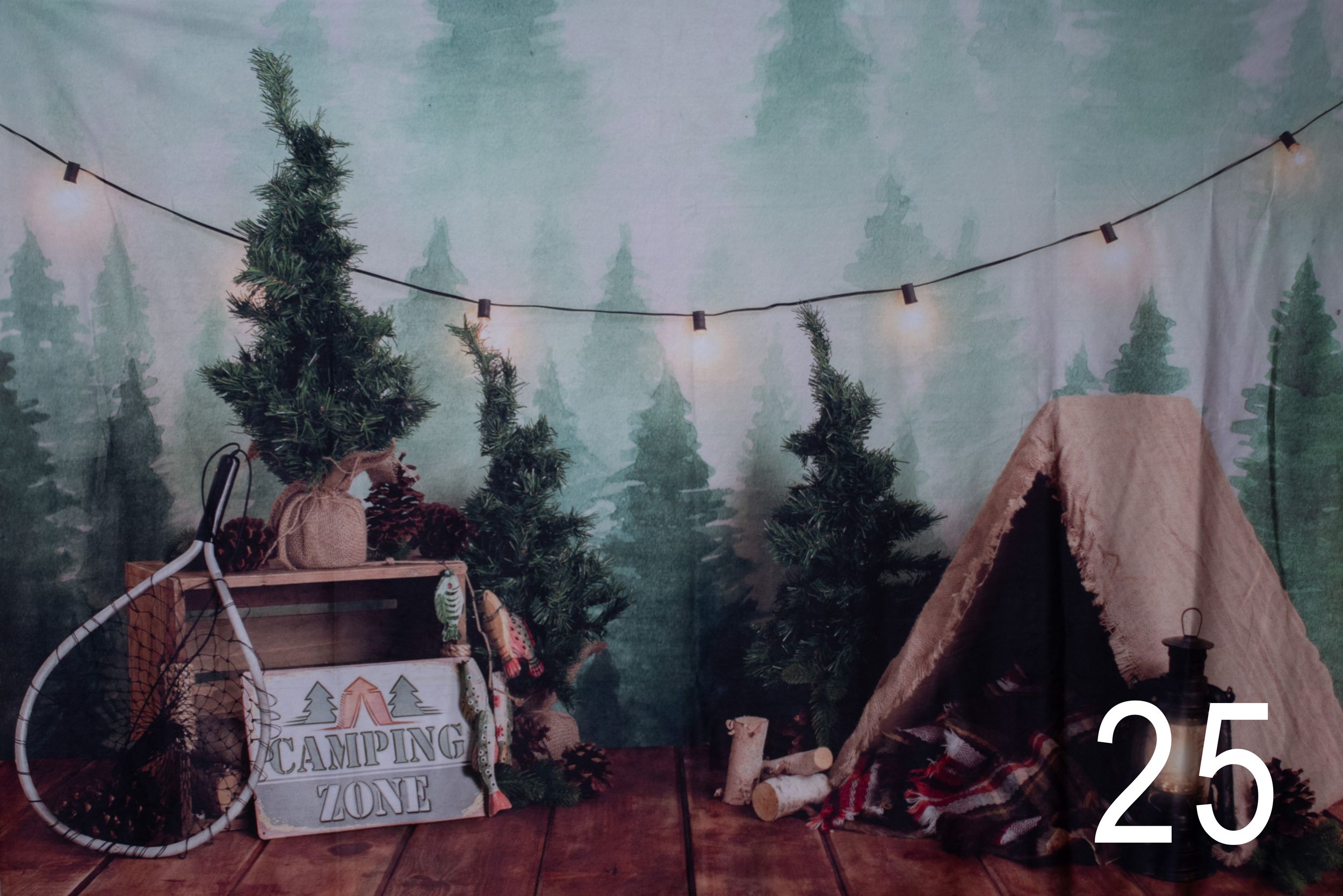 A cozy camping scene with two tents and string lights against a misty forest backdrop in winter.
