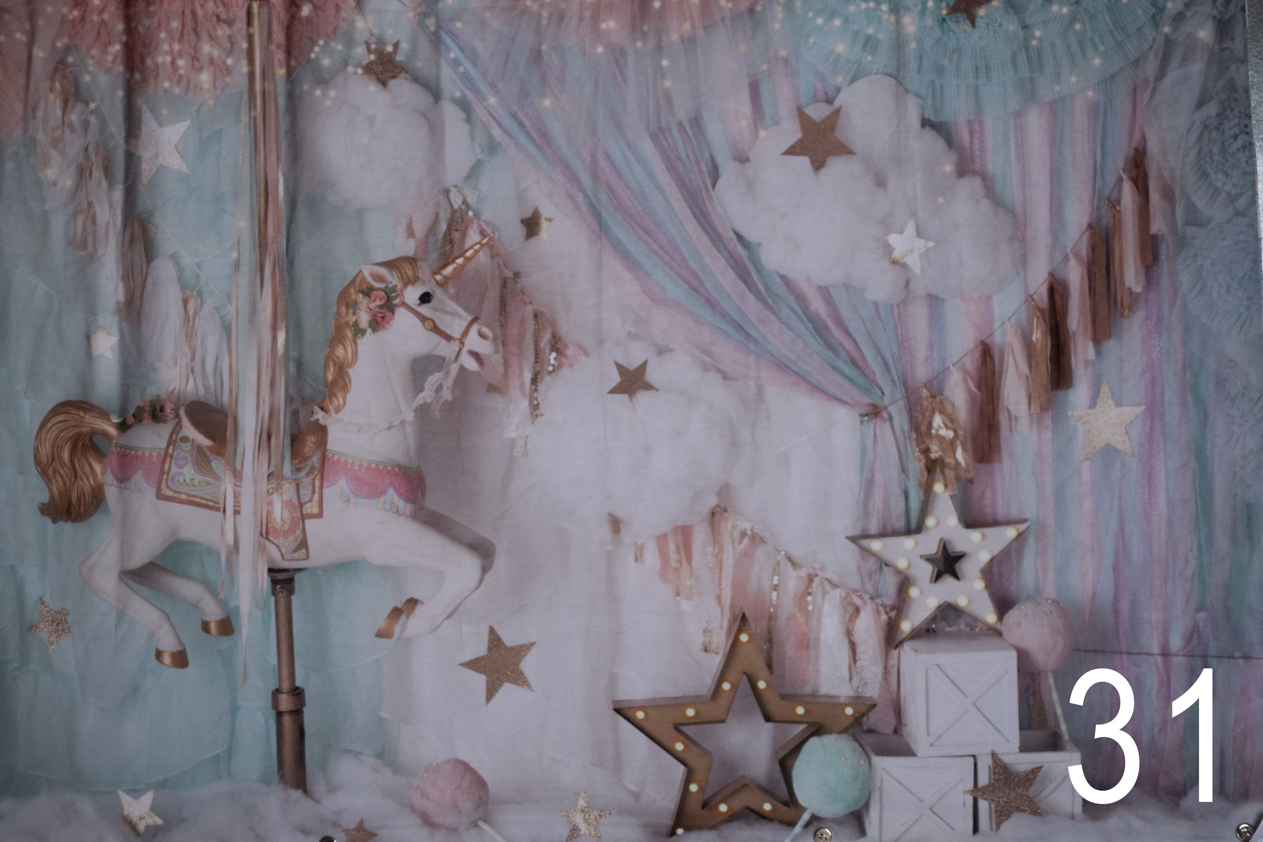 Ethereal winter scene with hanging stars and string lights creating a dreamy, frosty atmosphere against a pale backdrop.