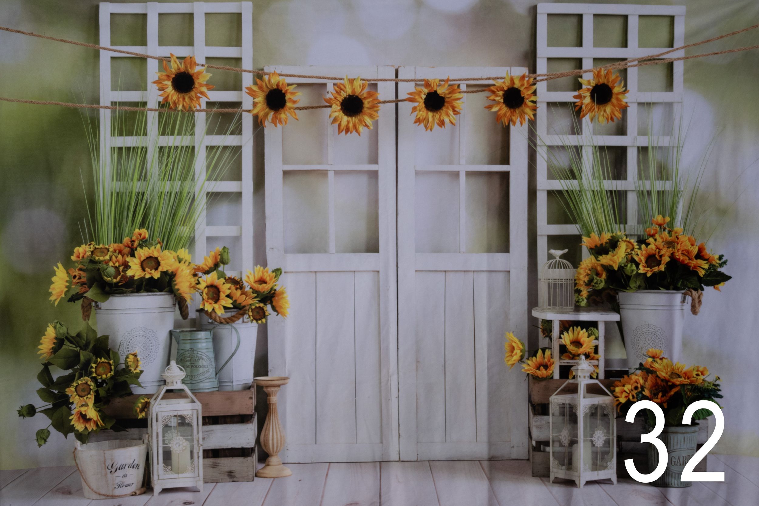 Rustic white window frames decorated with artificial sunflowers create a charming farmhouse wall display.