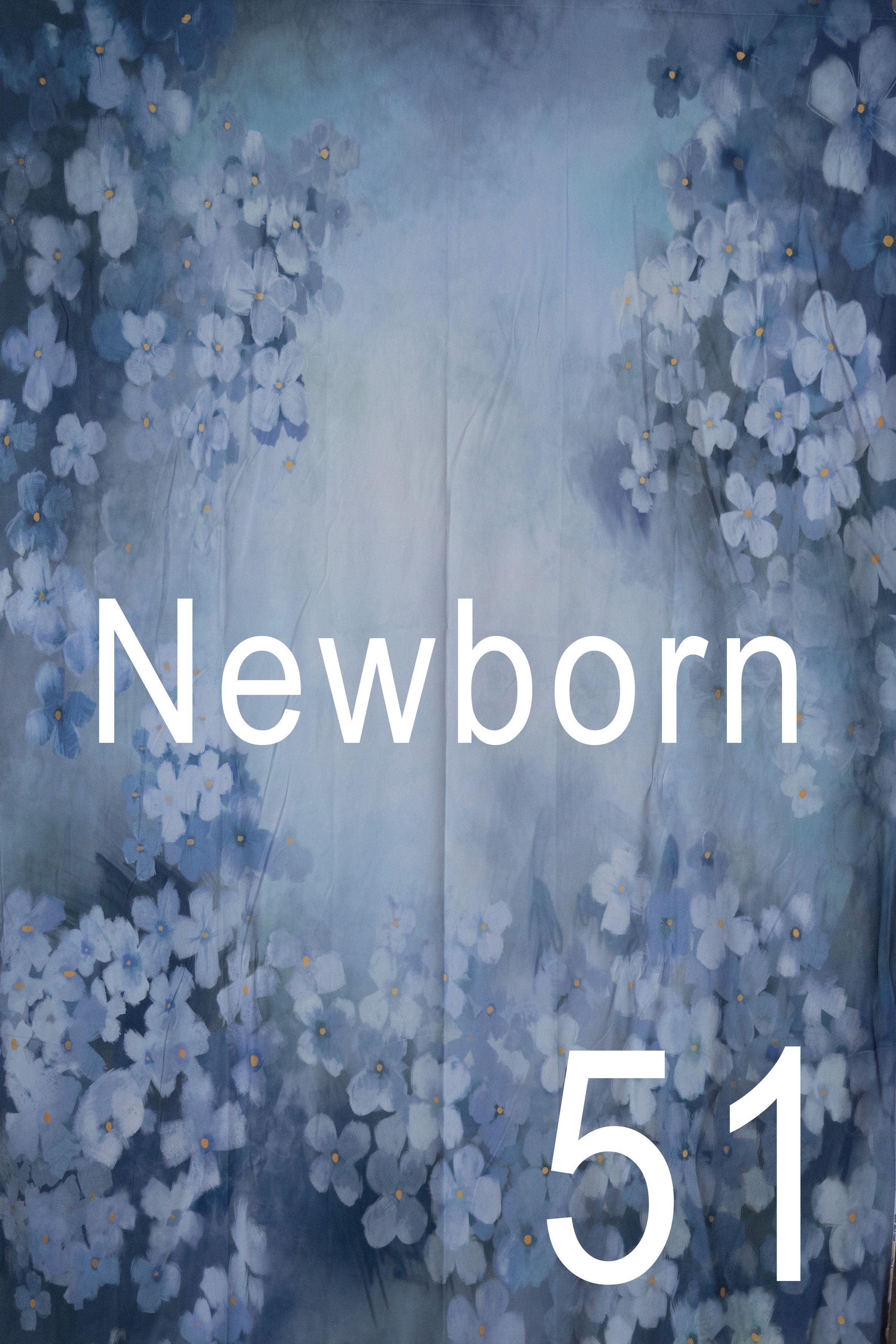 Abstract blue and white bokeh background with text overlay reading "Newborn" in white typography.