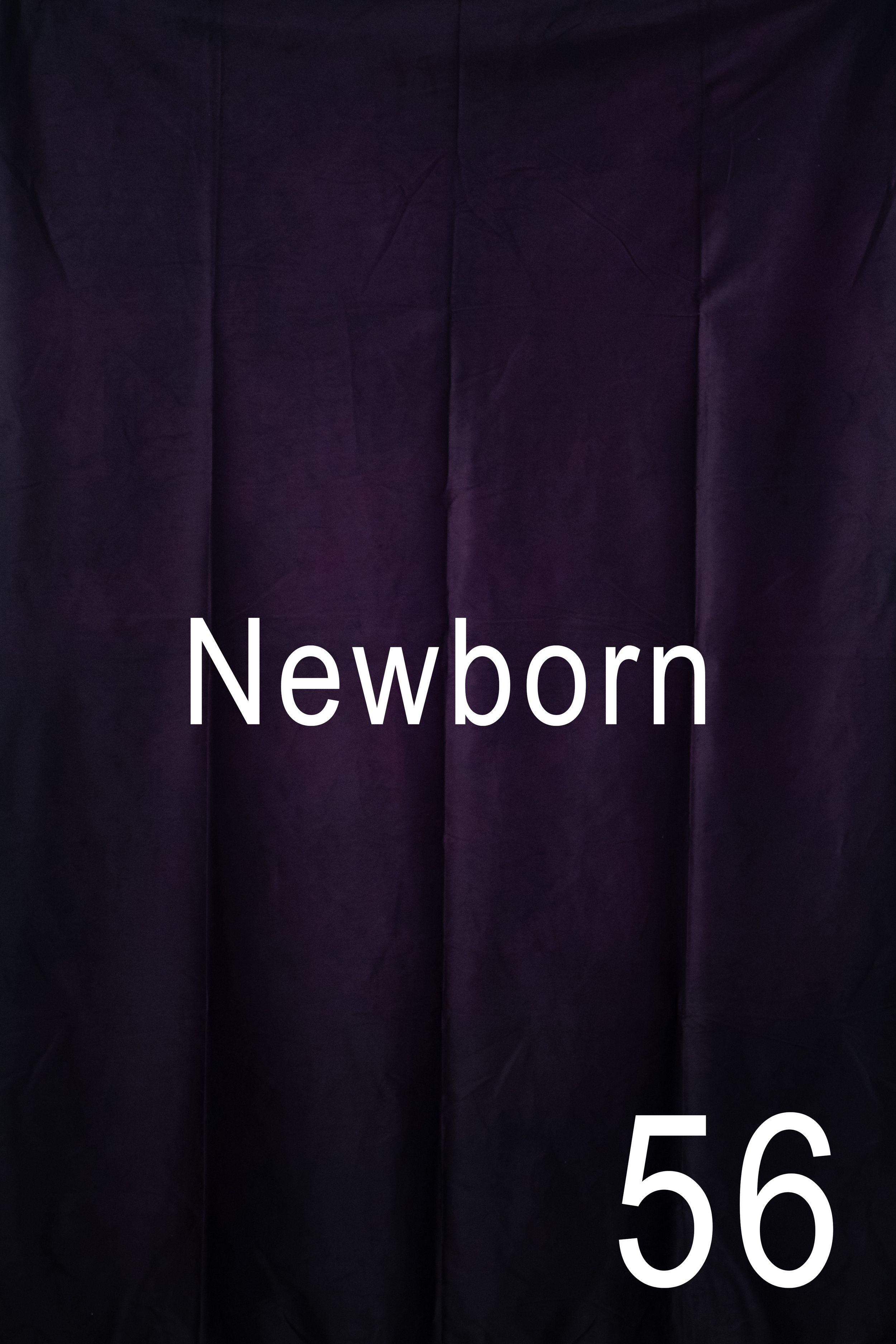 White text displaying 'Newborn' against a dark background with a dramatic lighting effect.
