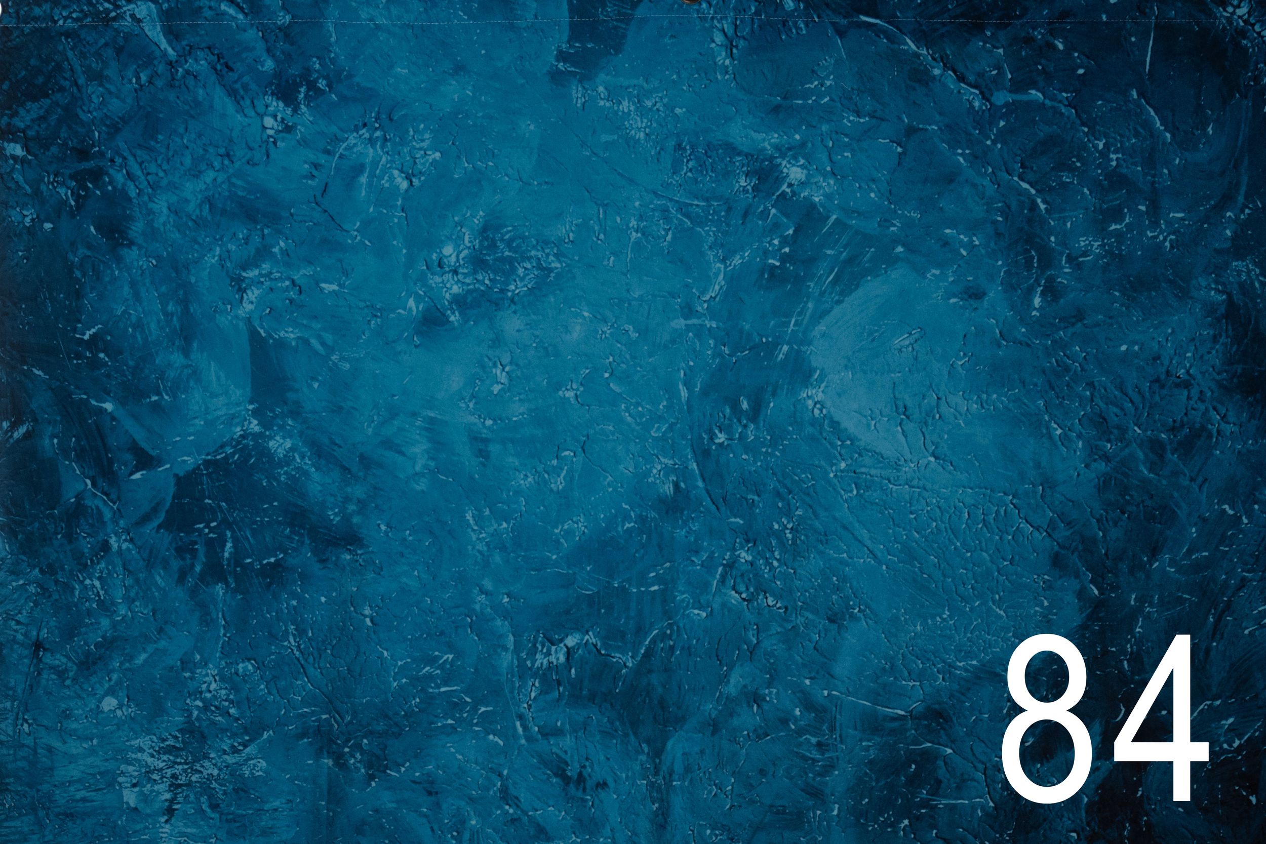 Dark teal blue grunge textured background with number 84 in white text on bottom right corner.