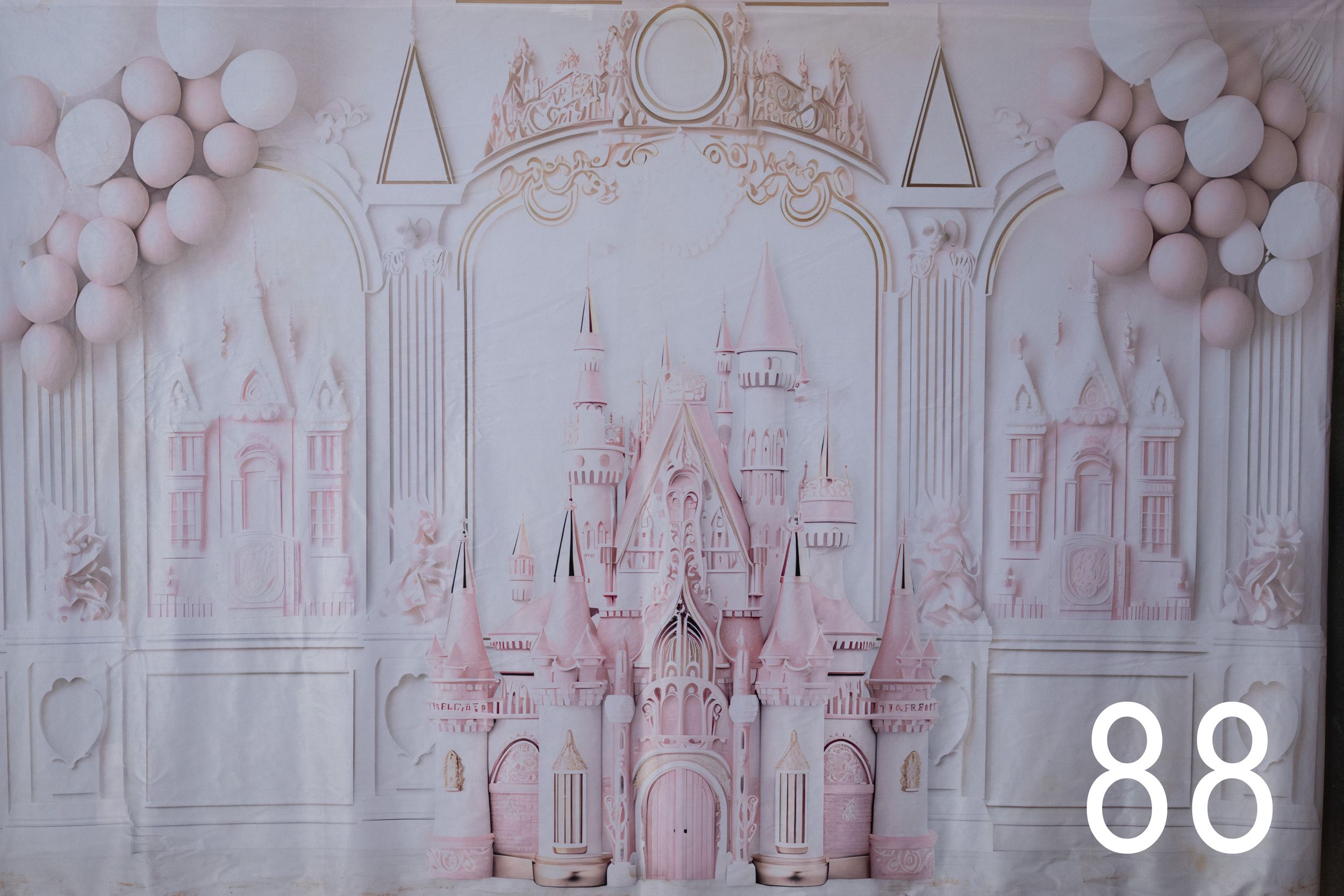 Delicate pink and white architectural sketches of buildings and structures form a repeating pattern on a light background.