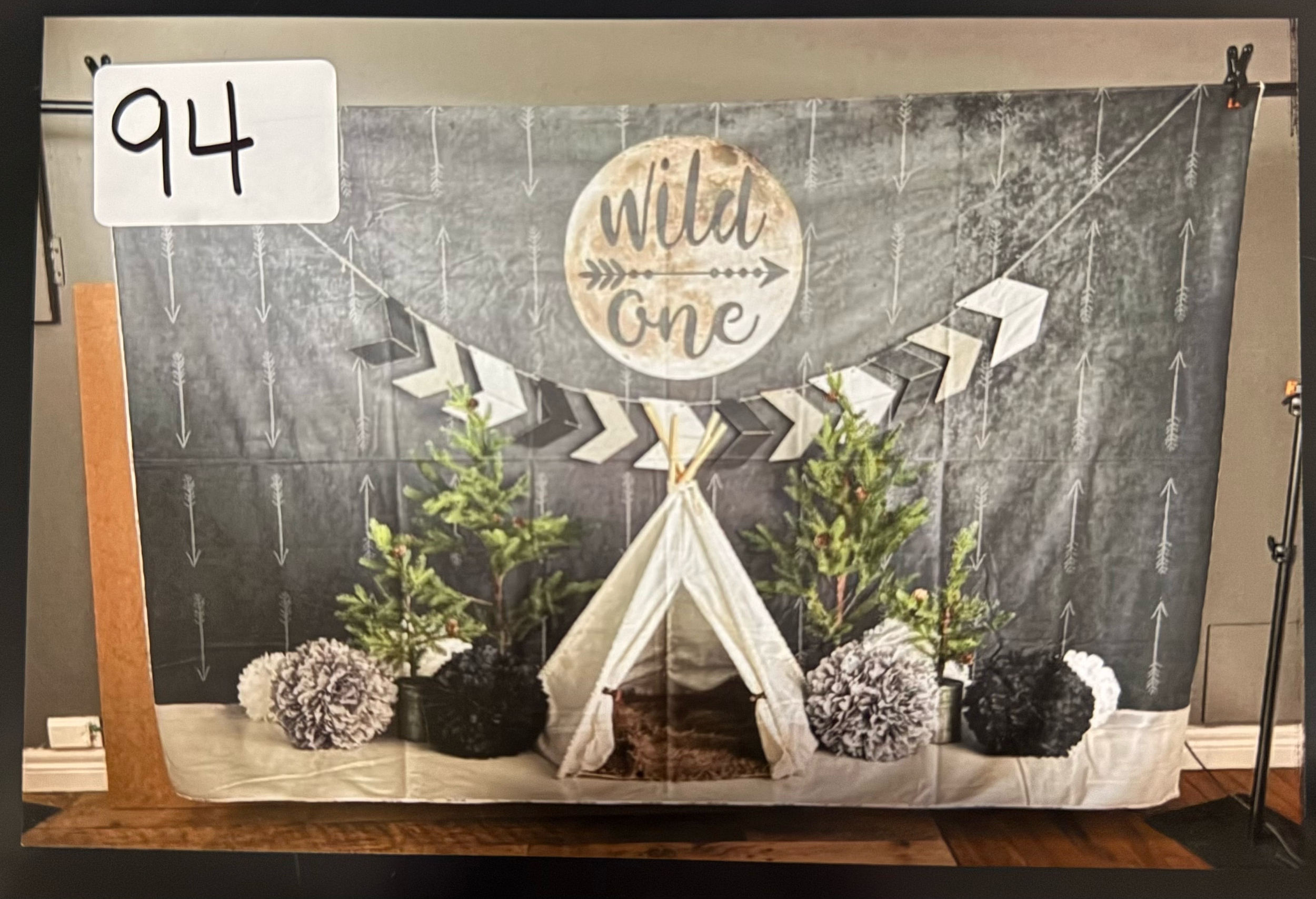 Rustic chalkboard wall display featuring decorative arrows and woodland-themed elements in a cozy home setting.