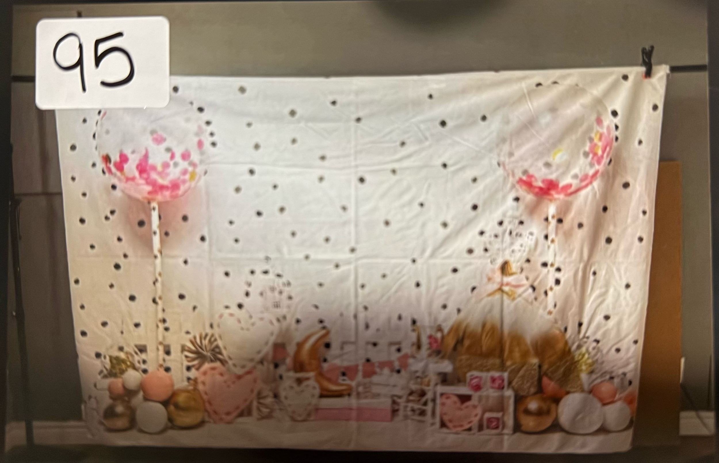 A panoramic view of abstract art panels with red and brown splatter patterns against a white background.