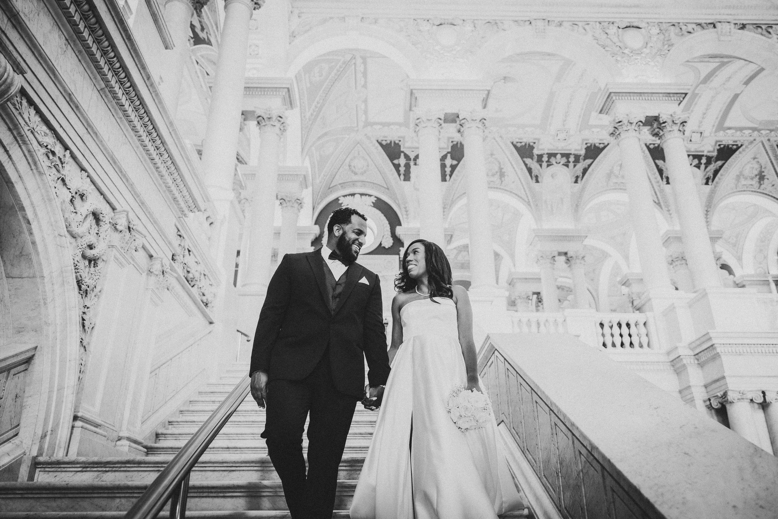 Black and white wedding ceremony photos showing a couple in formal attire during their special moment in an elegant venue.