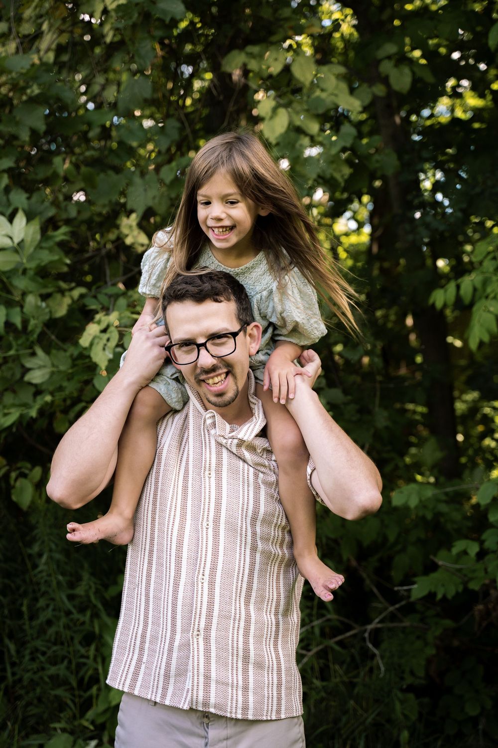 A playful sequence of outdoor family portraits showing joyful piggyback rides among green foliage.