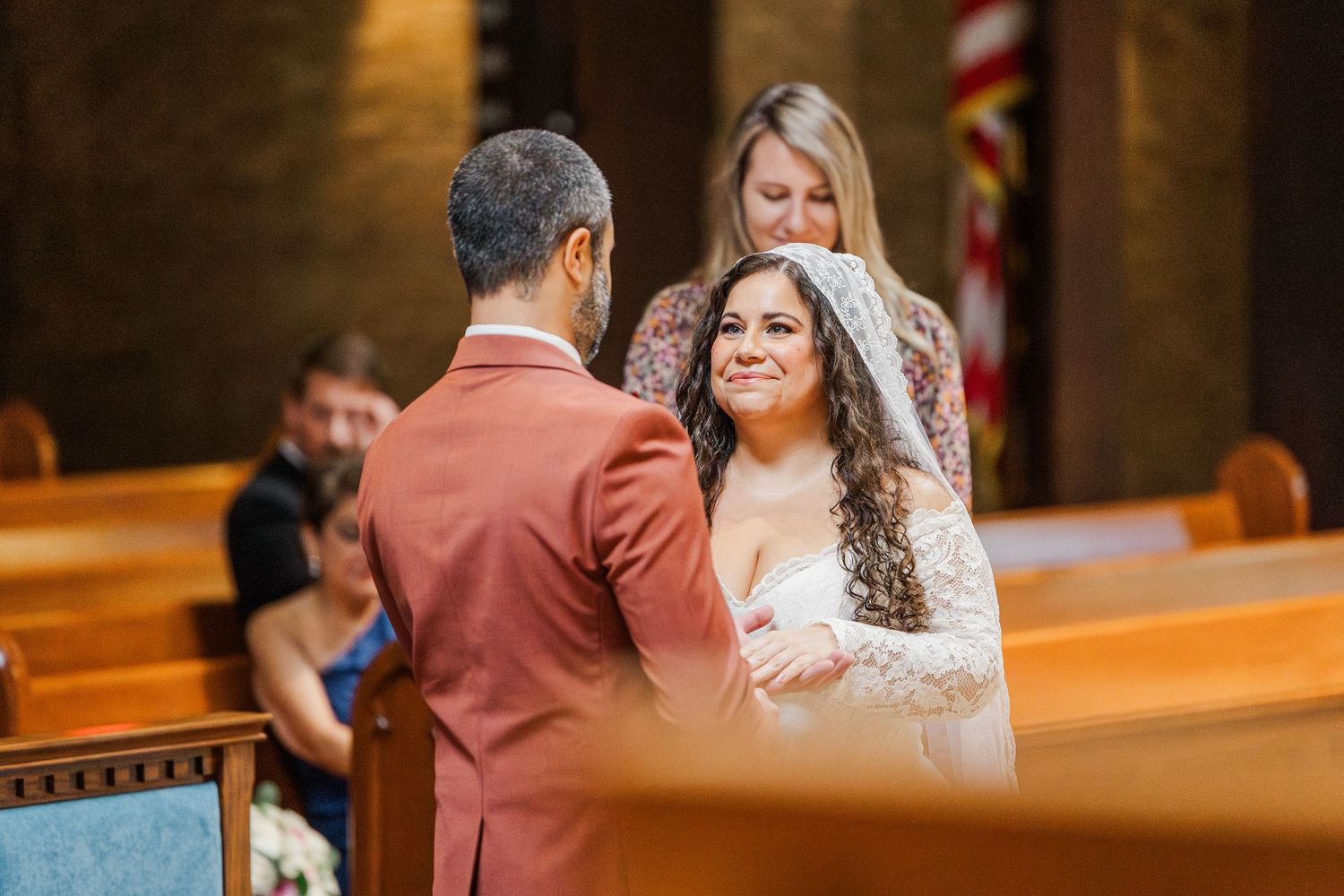 A bride and groom share an intimate moment during their church wedding ceremony.