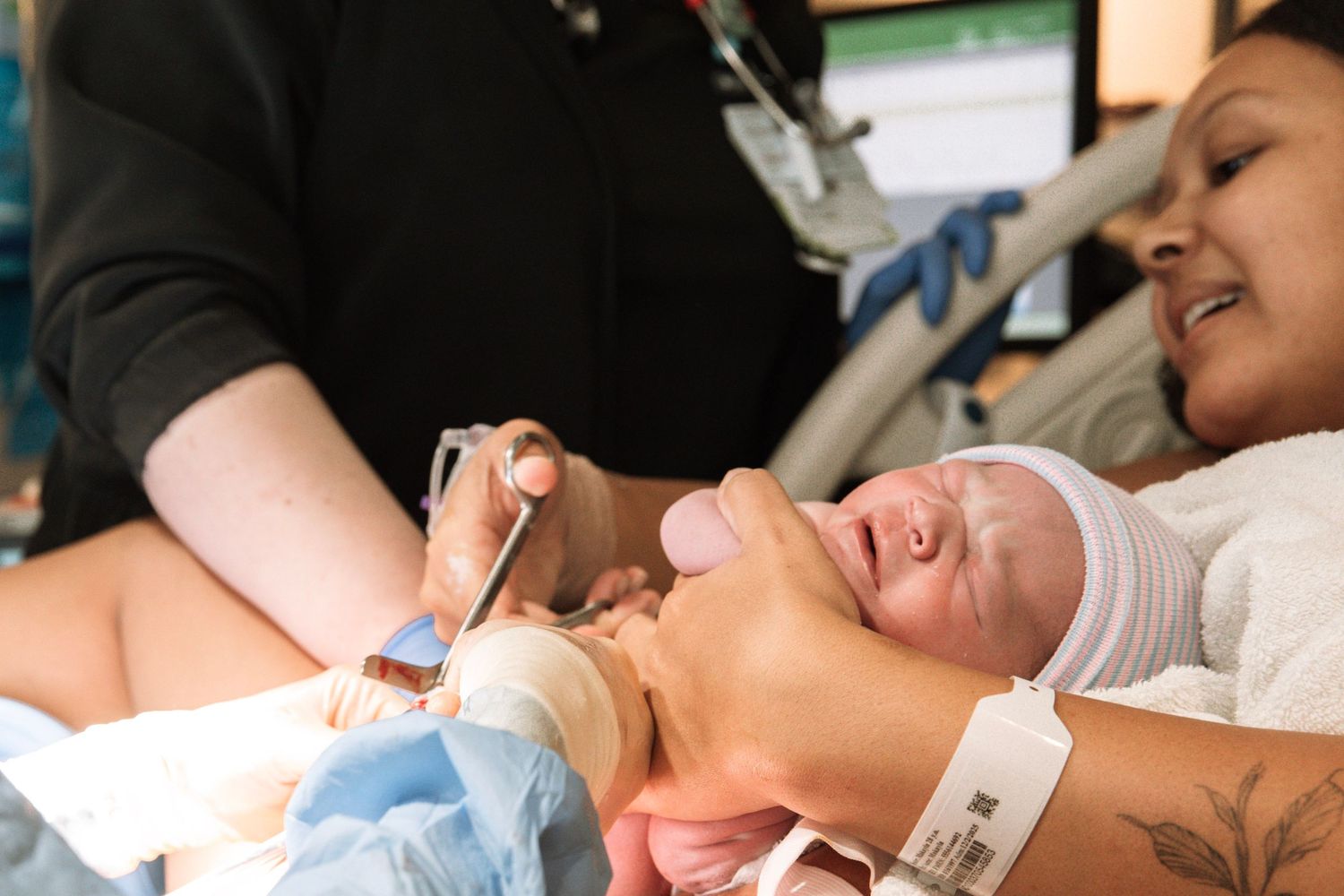 Nashville area birth photographer capturing first moments after delivery
