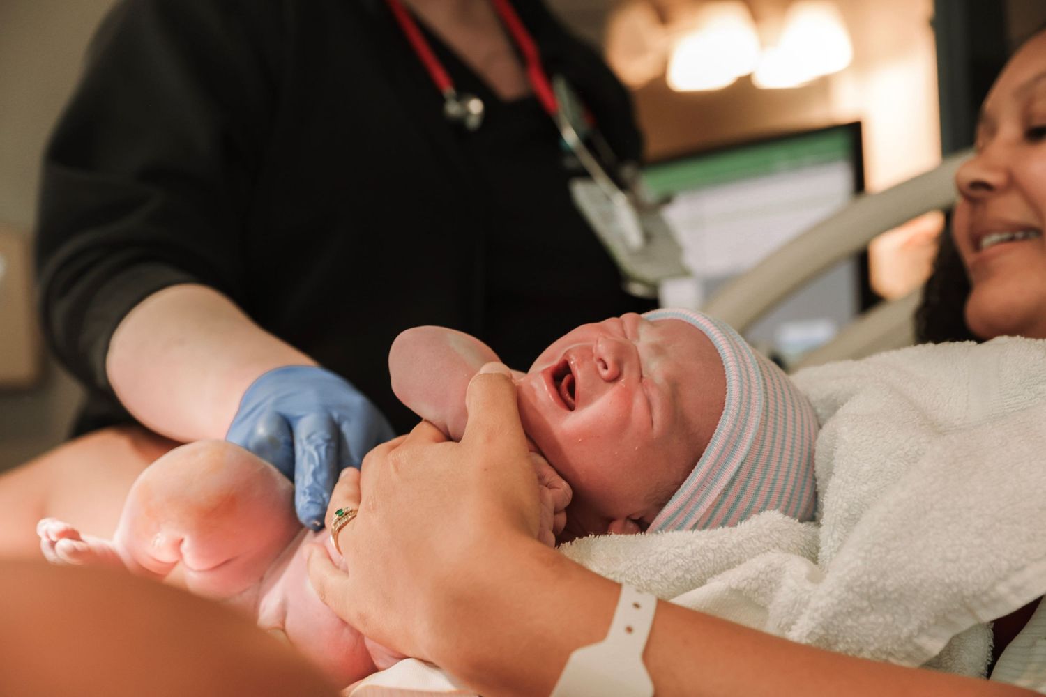 Nashville area birth photographer capturing first moments after delivery