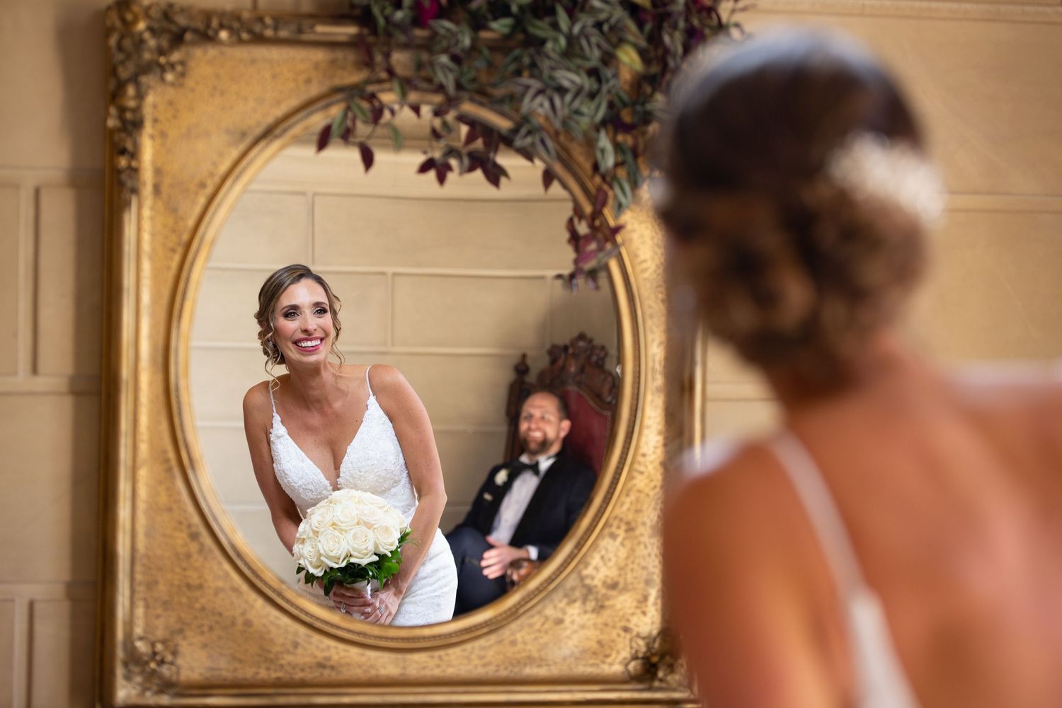 Bride sees her & groom’s reflection in a frame at Aldrich Mansion, Warwick, RI with Leah Ramuglia Wedding Photography