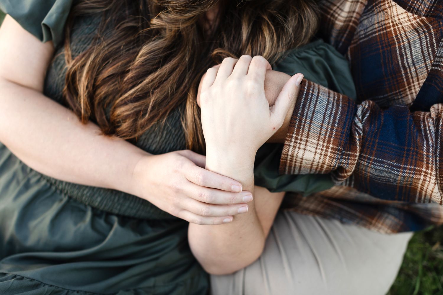 Close up of couple holding hands for a couple photo shoot in Concord, Massachusetts. Lakes Region Seacoast, North Shore couple photographer
