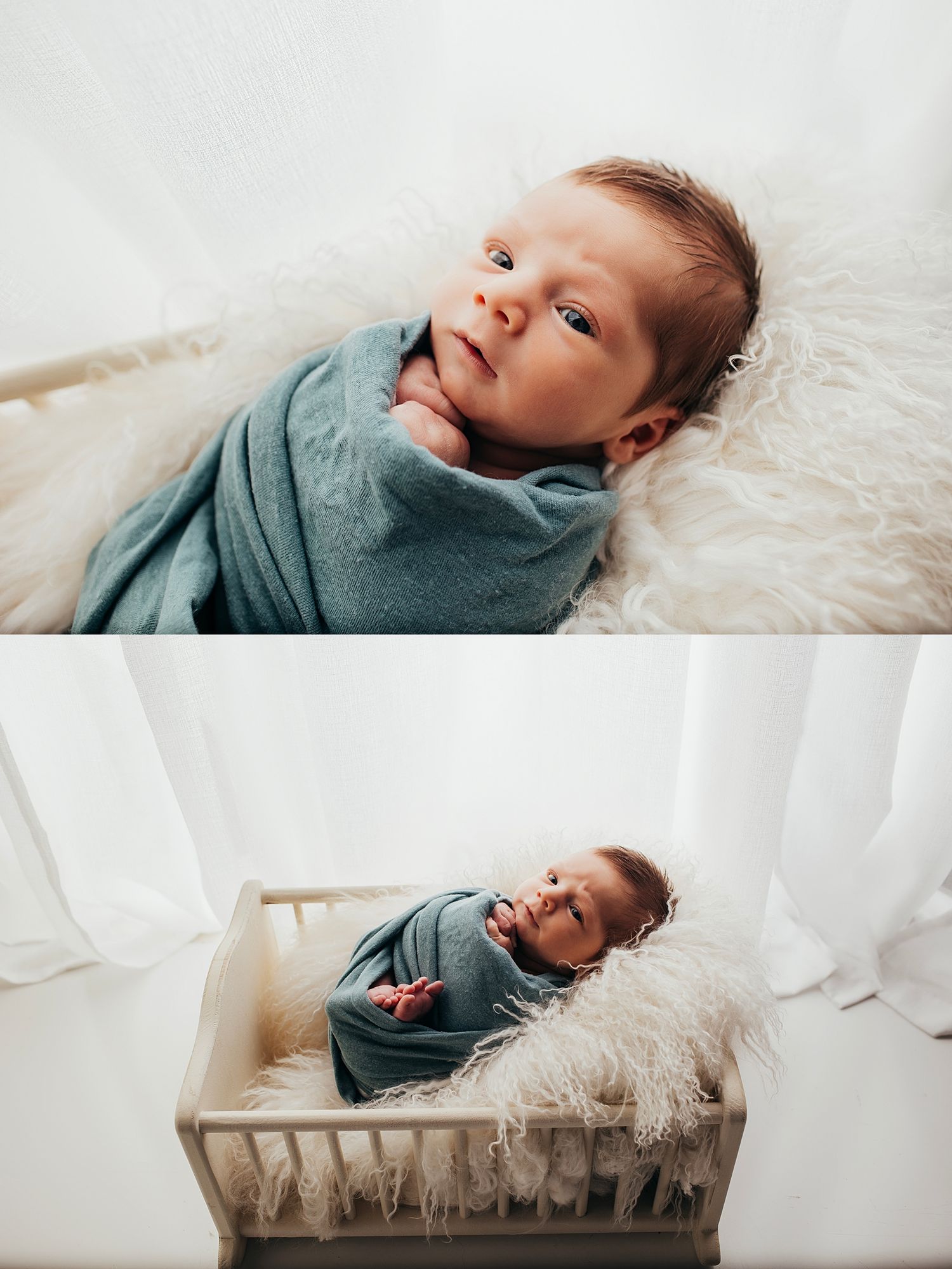 Newborn baby swaddled in blue wrap lying on fluffy white fur in a wooden crib during a studio photo session.