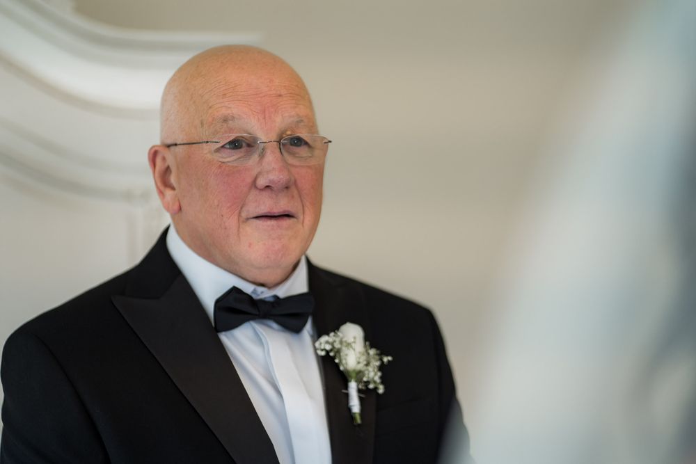 Father seeing daughter in wedding dress for first time Newark