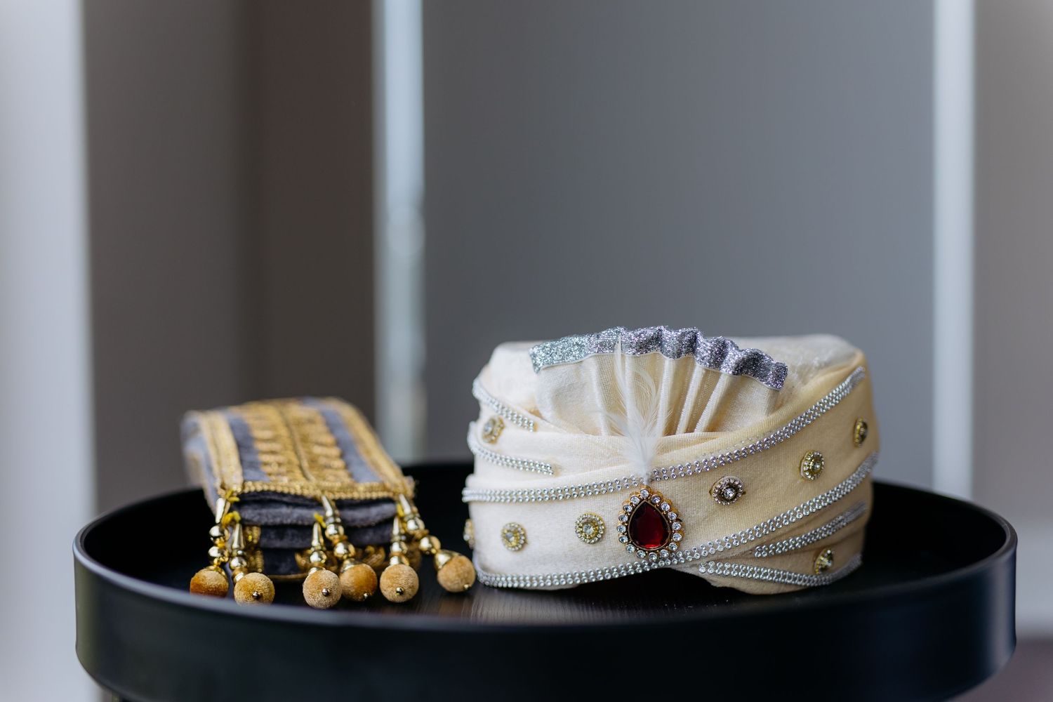 Close up of Indian groom's jewellery and accessories