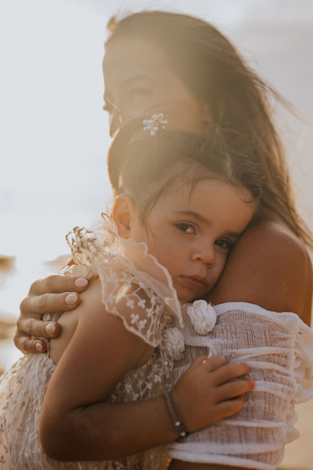 Beach family photography in Bali with an 
ocean backdrop