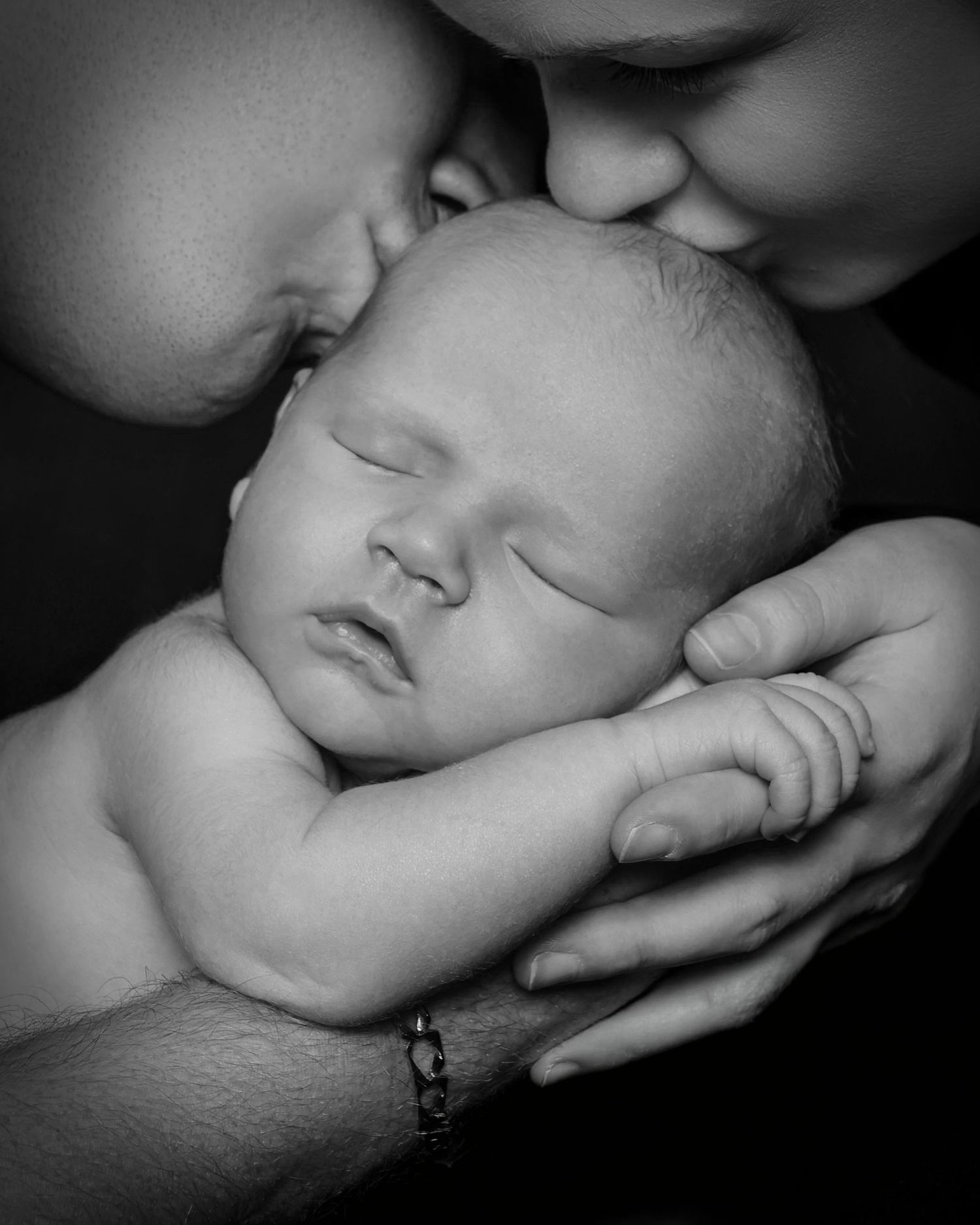 Family studio portrait with soft lighting and neutral backdrop in Miramichi