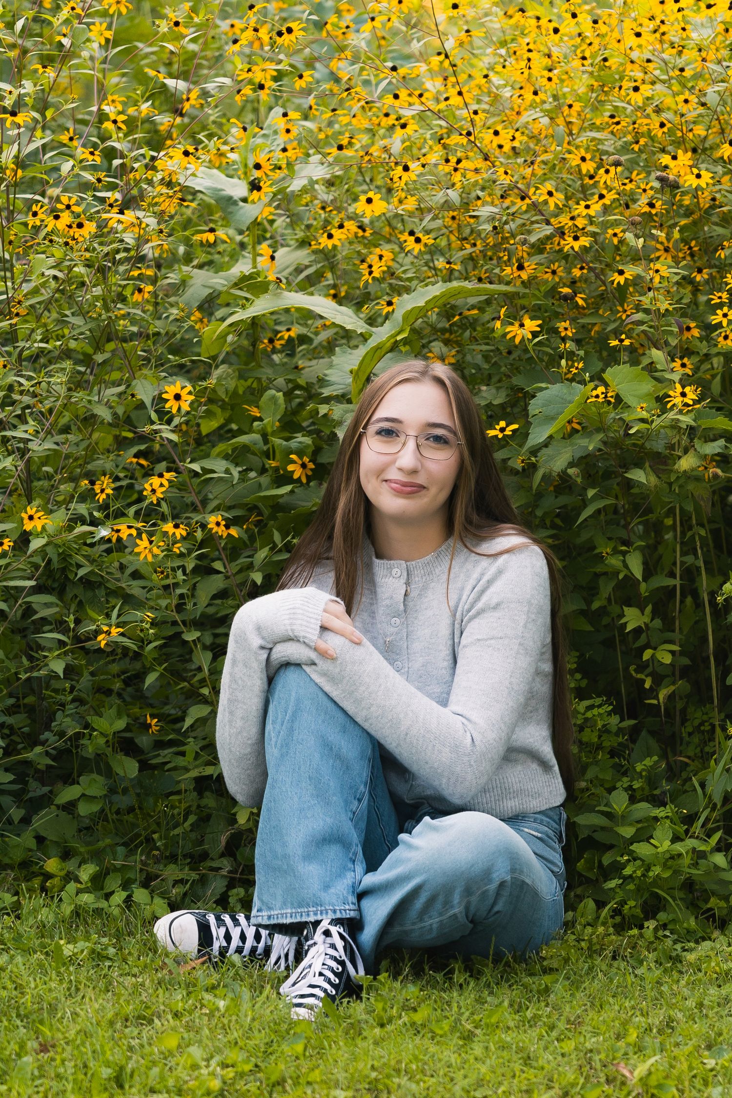 festge county park cross plains wisconsin senior photo location natural wildflowers yellow greenery field epic views rustic stone wall wi