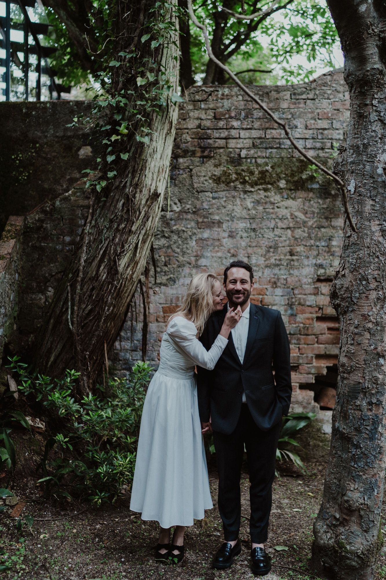 Portugal elopement photographer capturing raw, joyful moment between couple at Casa dos Penedos, Sintra