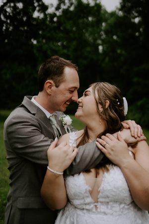 Candid wedding photos capture loving exchanges between newlyweds in garden setting.