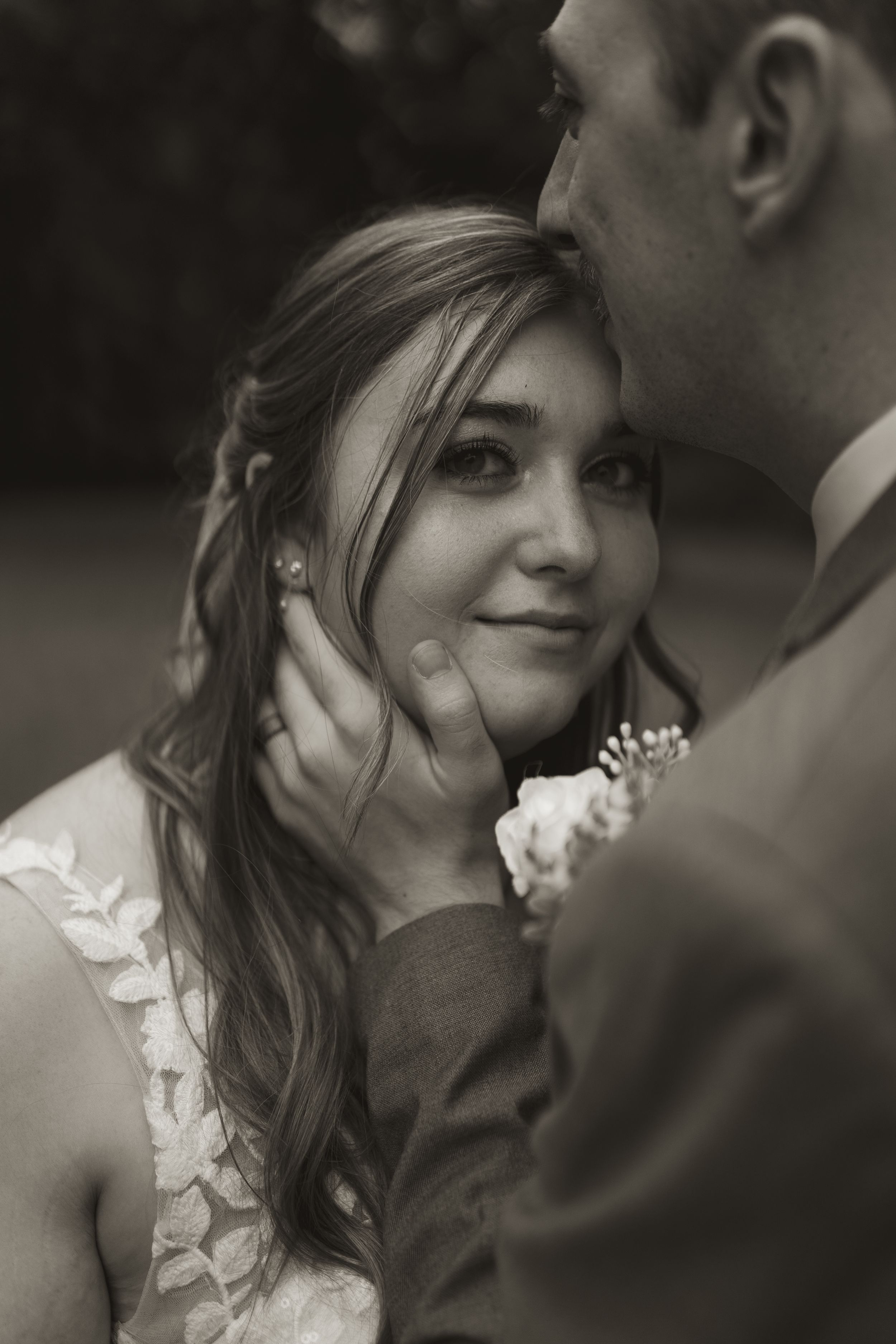 Black and white portrait of romantic wedding couple moment.