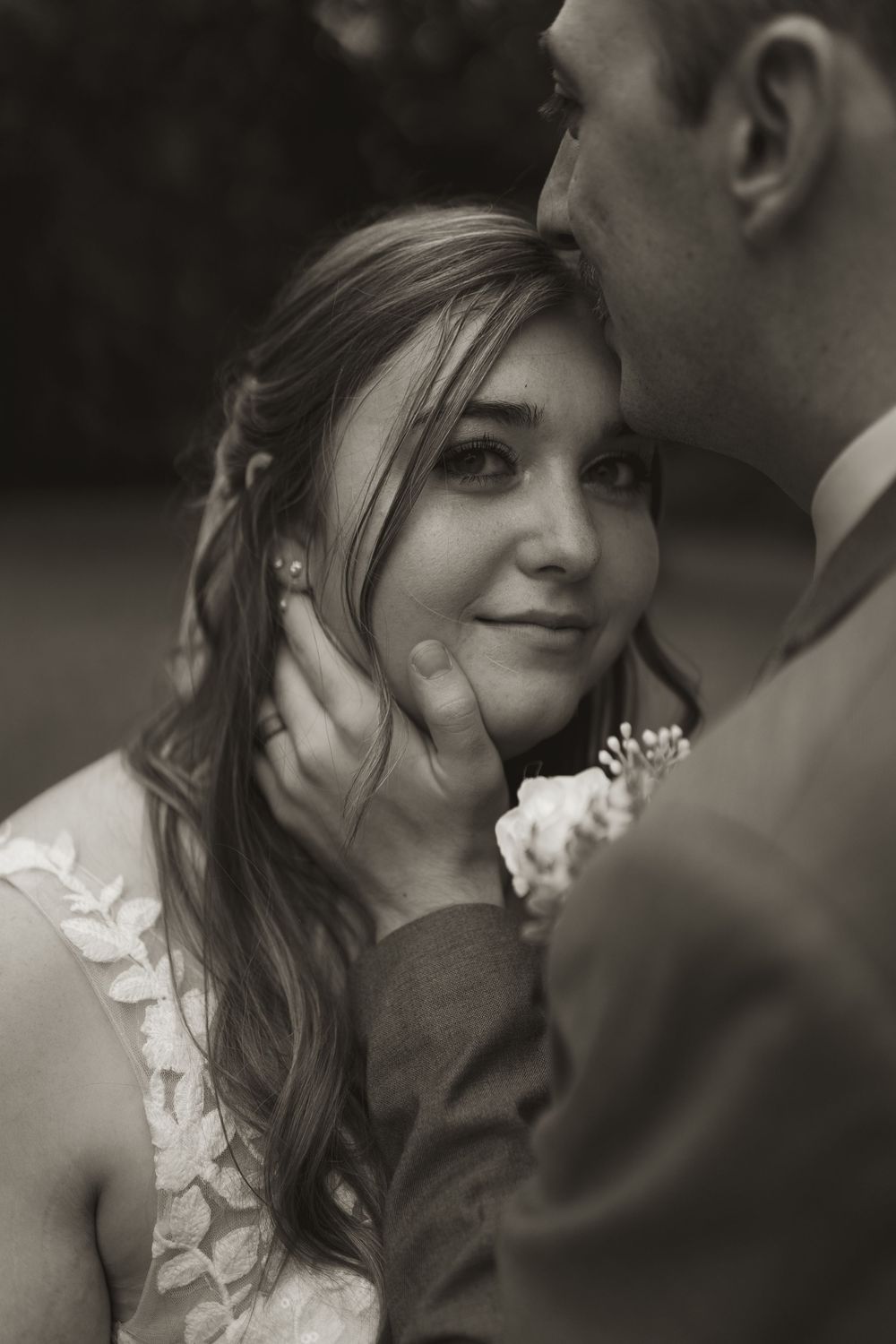 Black and white portrait of romantic wedding couple moment.