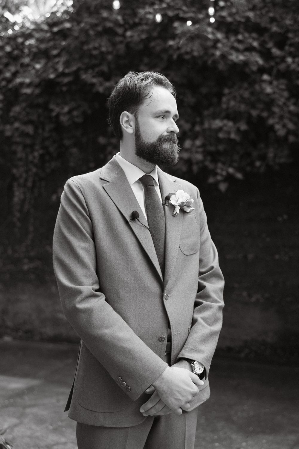 Black and white photo of groom seeing his bride for the first time