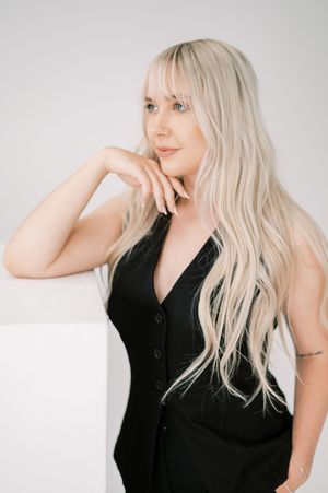 Artistic headshots featuring platinum blonde hair and black sleeveless top against white background.