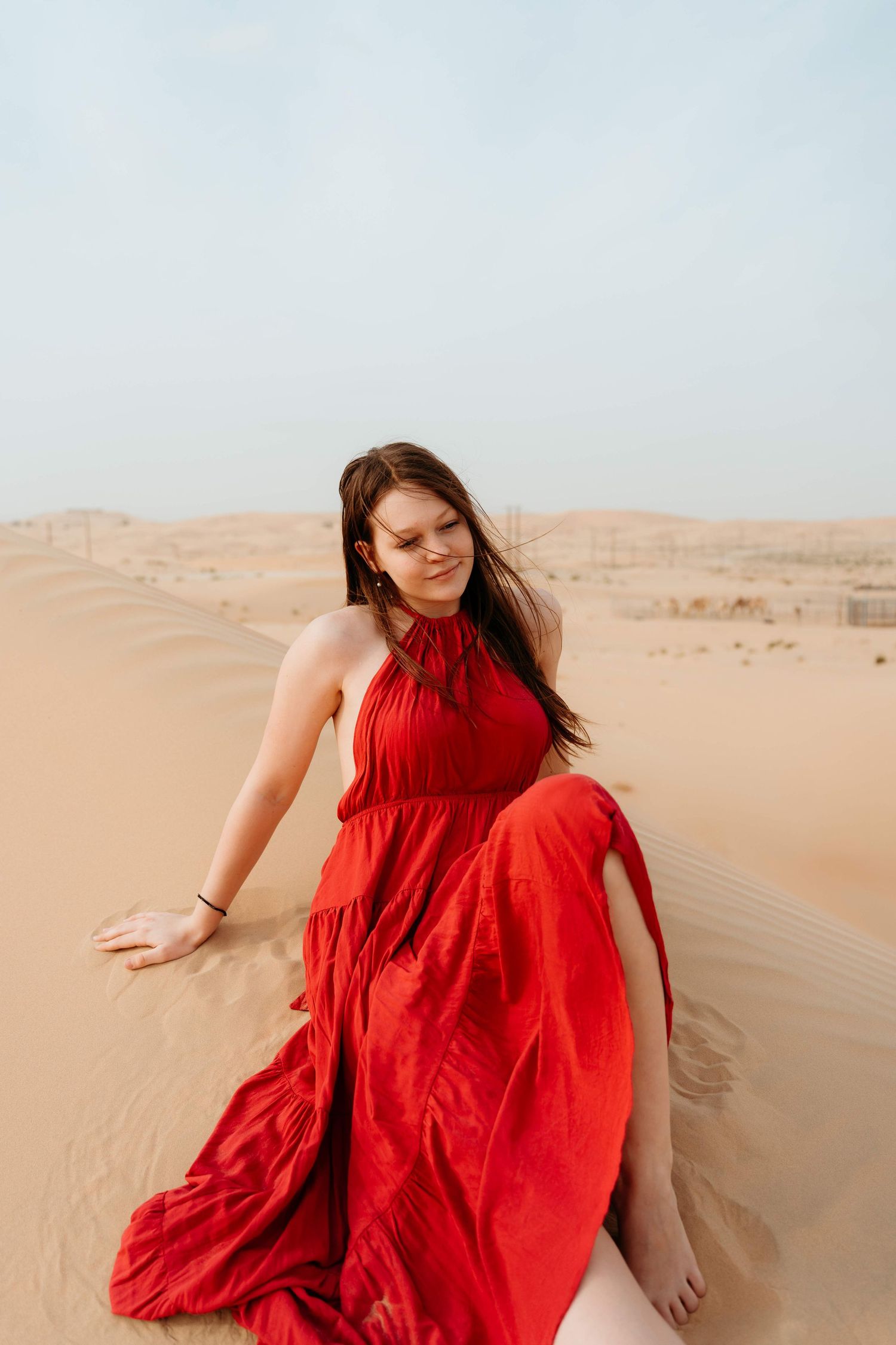 desert photoshoot in abu dhabi clinet closet options red dress