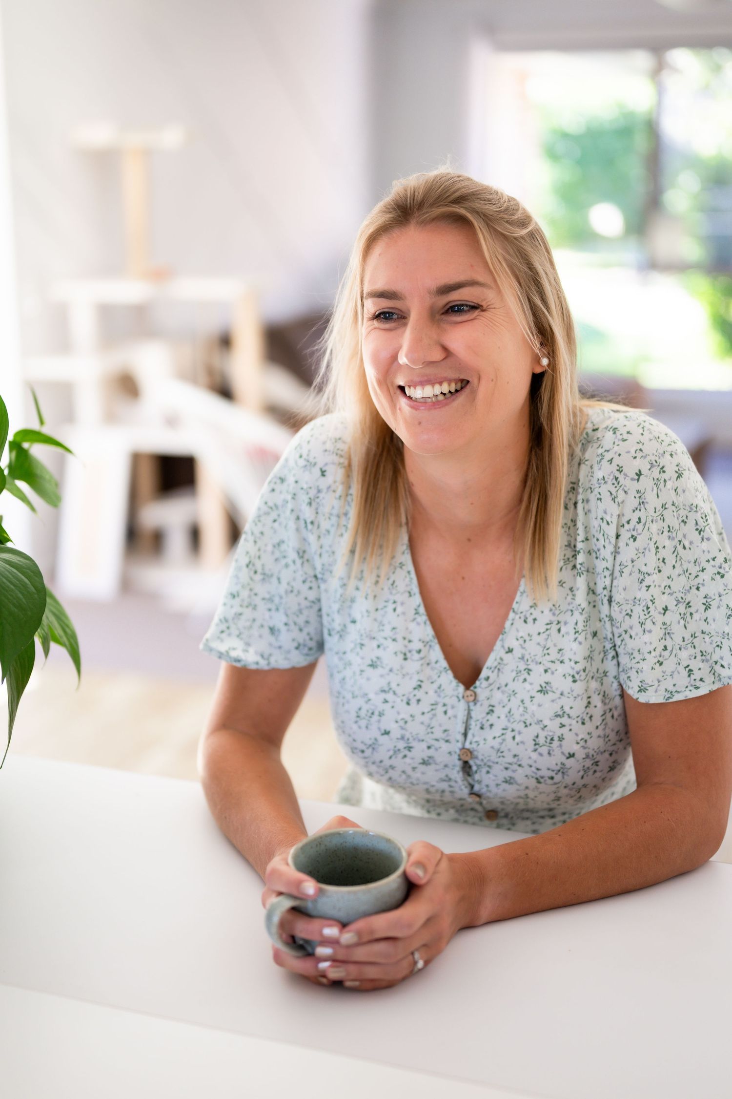 Lifestyle branding portrait of a businesswoman holding coffee - casual and confident branding photography on the Gold Coast.