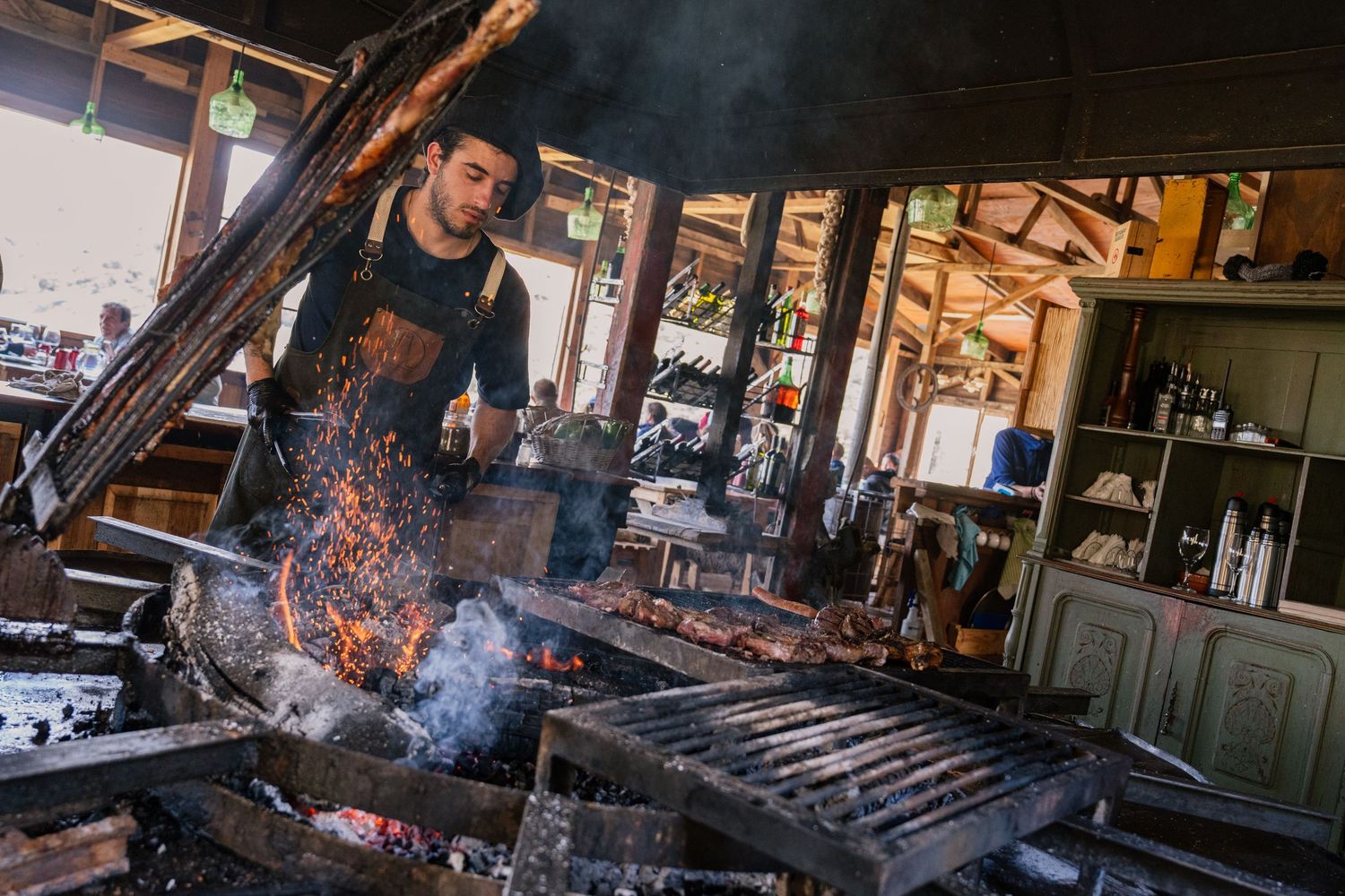 Argentinian asador cooking over an open fire